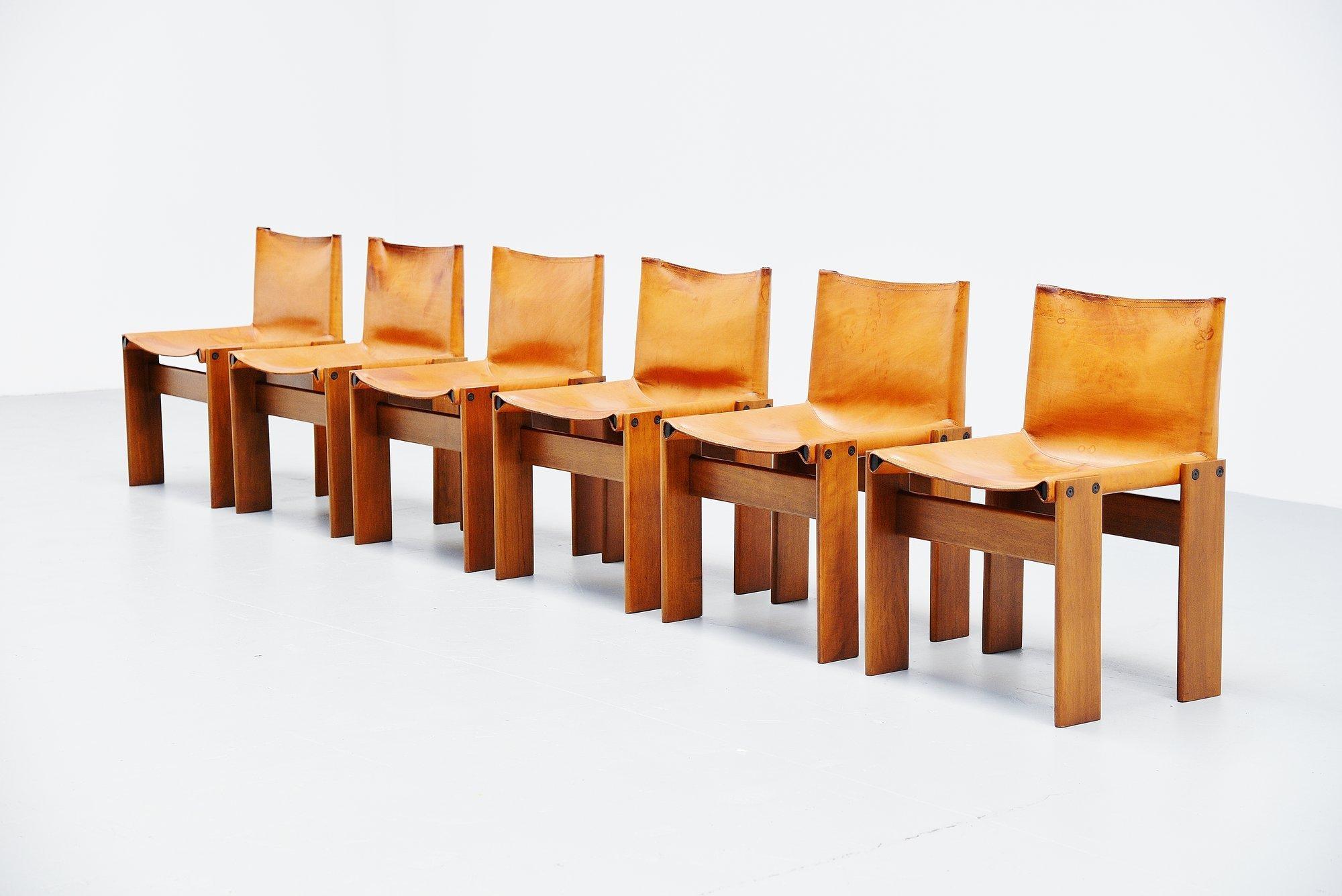 Spectacular set of 6 'Monk' chairs designed by Afra e Tobia Scarpa and manufactured by Molteni, Italy 1974. This is for a set of 6 chairs with solid walnut wooden frames and beautiful patinated natural leather seats. These chairs look really amazing