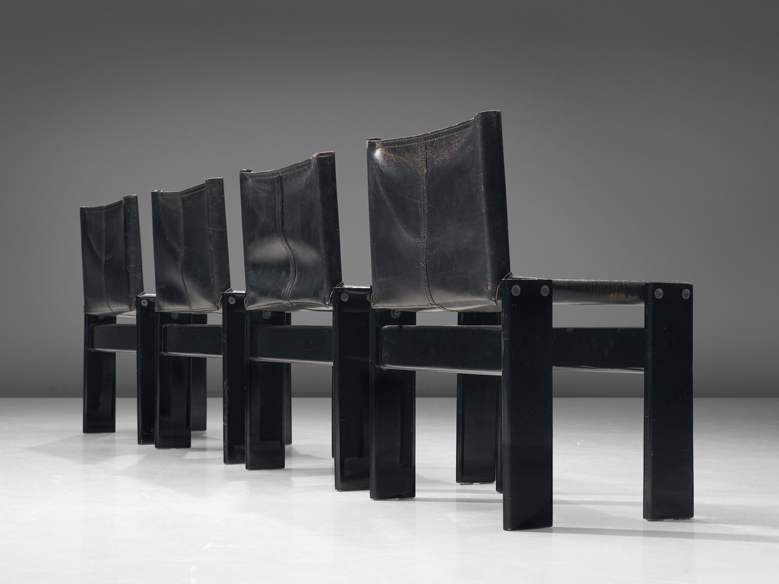 Afra & Tobia Scarpa for Molteni, Monk set of four dining chairs, black lacquered wood and black leather, Italy, 1974.

The wonderfully deep black leather is a wonderful combination with the black lacquered wood. Interesting is the 'flat' shape of