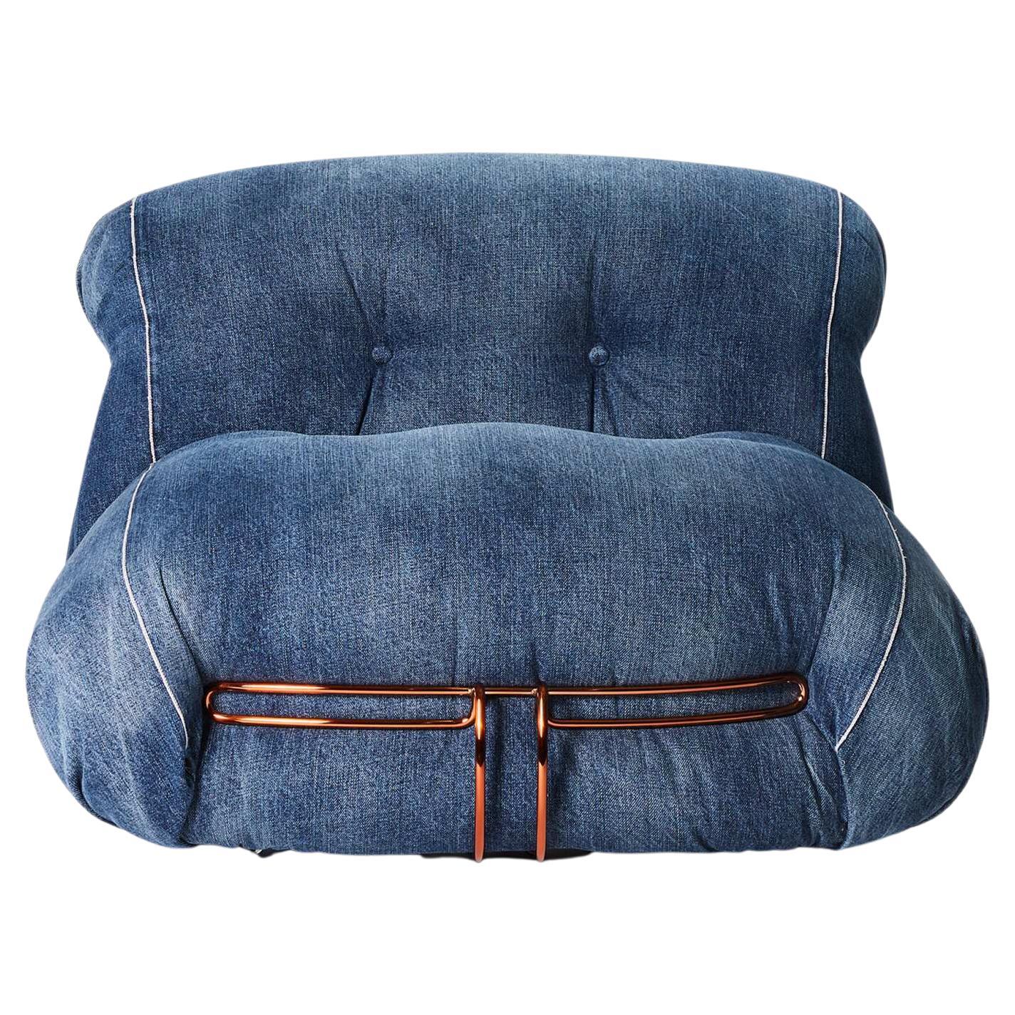 Afra And Tobia Scarpa Soriana Denim Crafted Armchair For Cassina

Jeans from the historic Roy Roger's® archive inspired the armchair upholstery and the stone-wash effect and hand-fading that run along the folds. The large metal brace that embraces