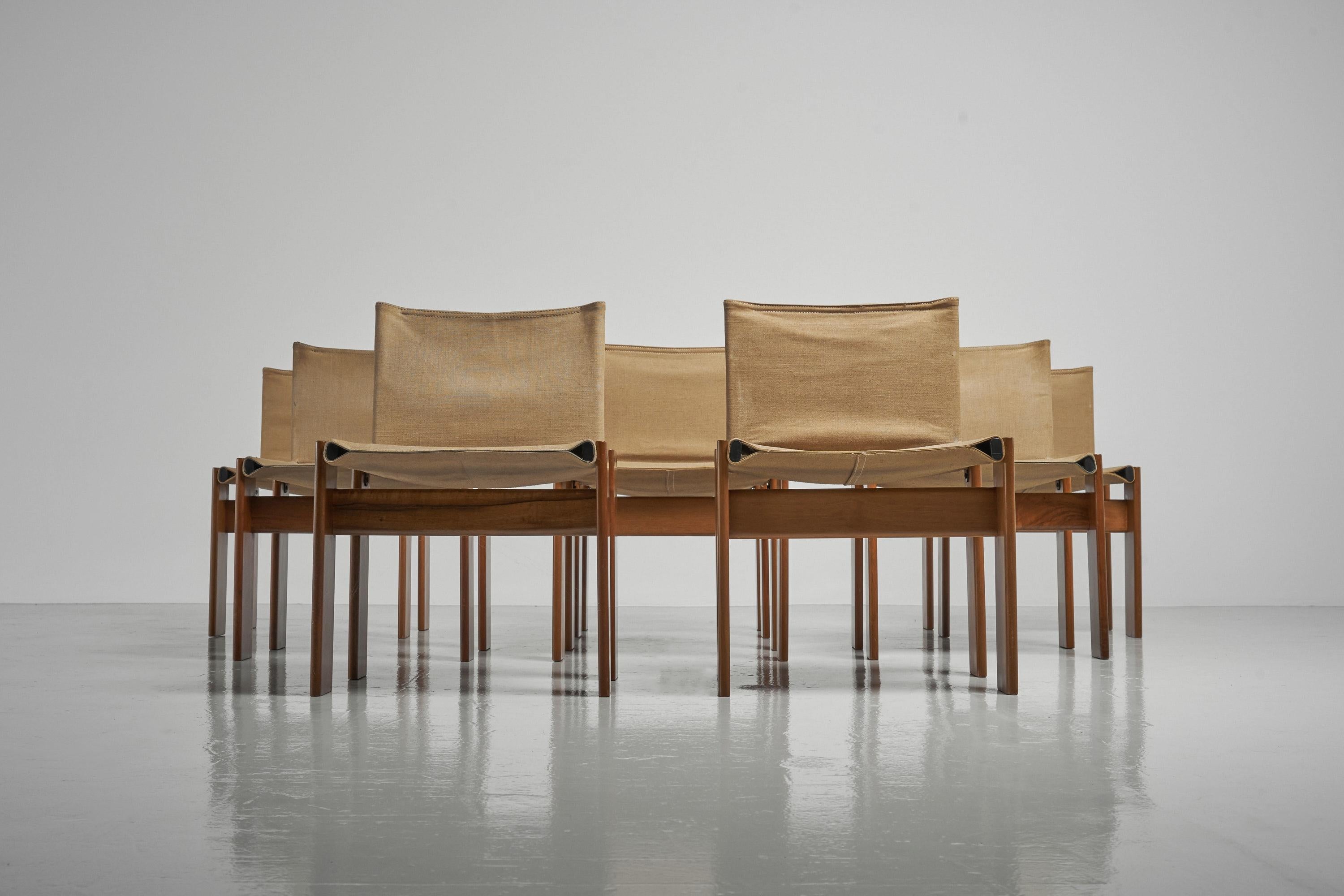 Iconic set of 8 so called 'Monk' dining chairs designed by Afra e Tobia Scarpa and manufactured by Molteni, Italy 1974. This is for a set of 8 chairs with solid walnut wooden frames and beautiful patinated natural canvas seats. The beautiful thick
