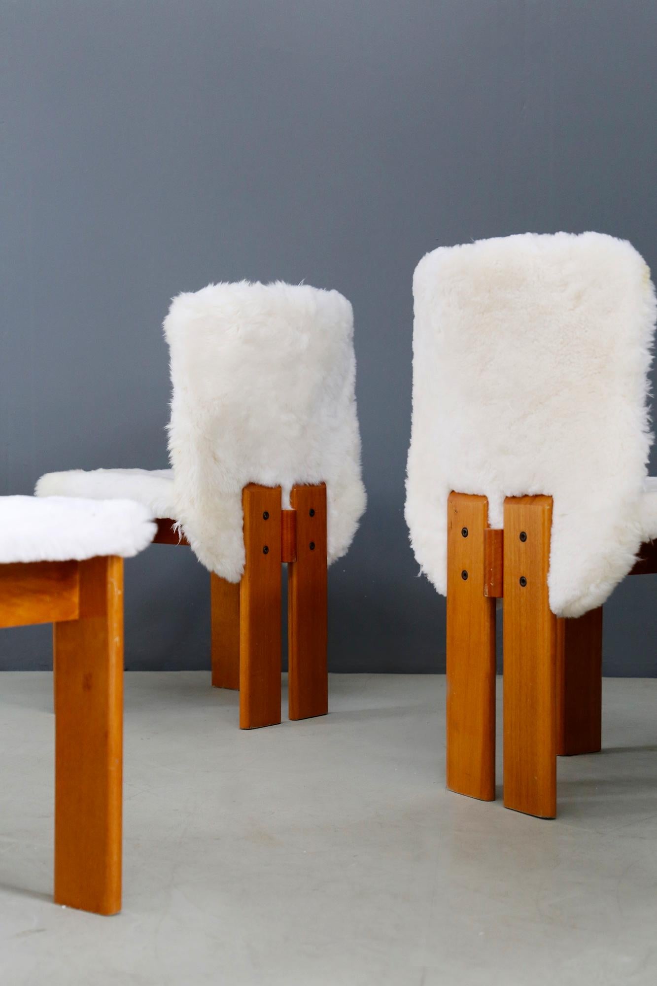 Chairs of Afra and Tobia Shoe from the 1970s. Each chair has been re-lined in real fur. The peculiarity of the seat in addition to its fur upholstery is the line of the wooden legs. Clean and essential lines typical of the designers Afra and Tobia