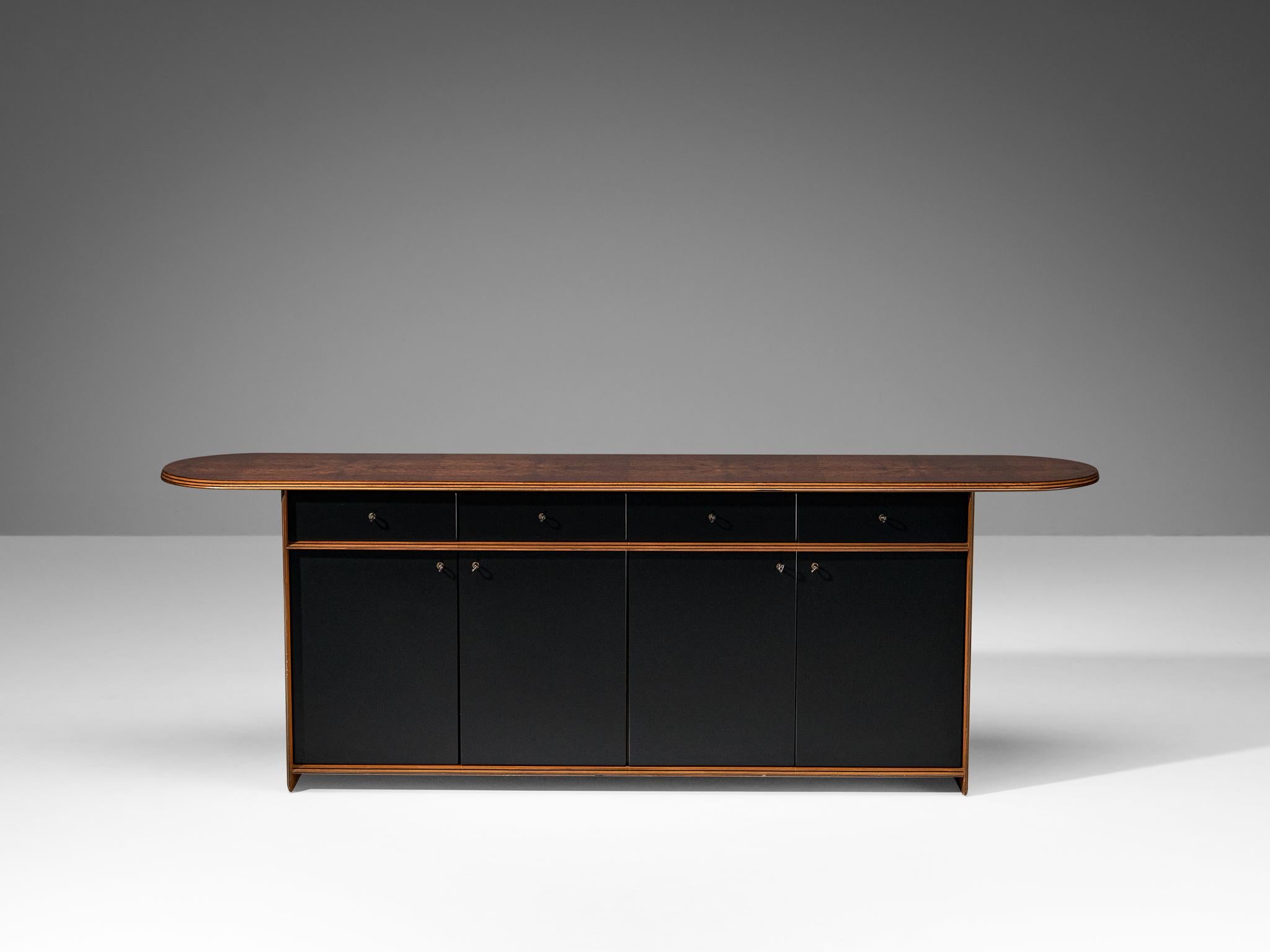 Afra & Tobia Scarpa for Maxalto, sideboard, walnut, leather, Italy, 1970s

Gorgeous sideboard made in walnut and leather and designed by duo Afra and Tobia Scarpa in the 1970s. This sideboard with a leather front is designed as part of the ‘Artona’