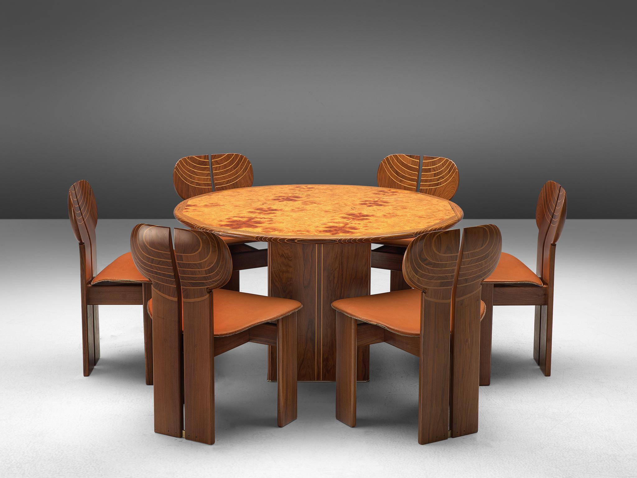 Afra & Tobia Scarpa for Maxalto, dining set, cognac leather, walnut, burl, and brass, Italy, 1975.

This dining set, consisting of 6 chairs and a round table are designed by Afra & Tobia Scarpa and are titled 'Africa' being part of the Artona