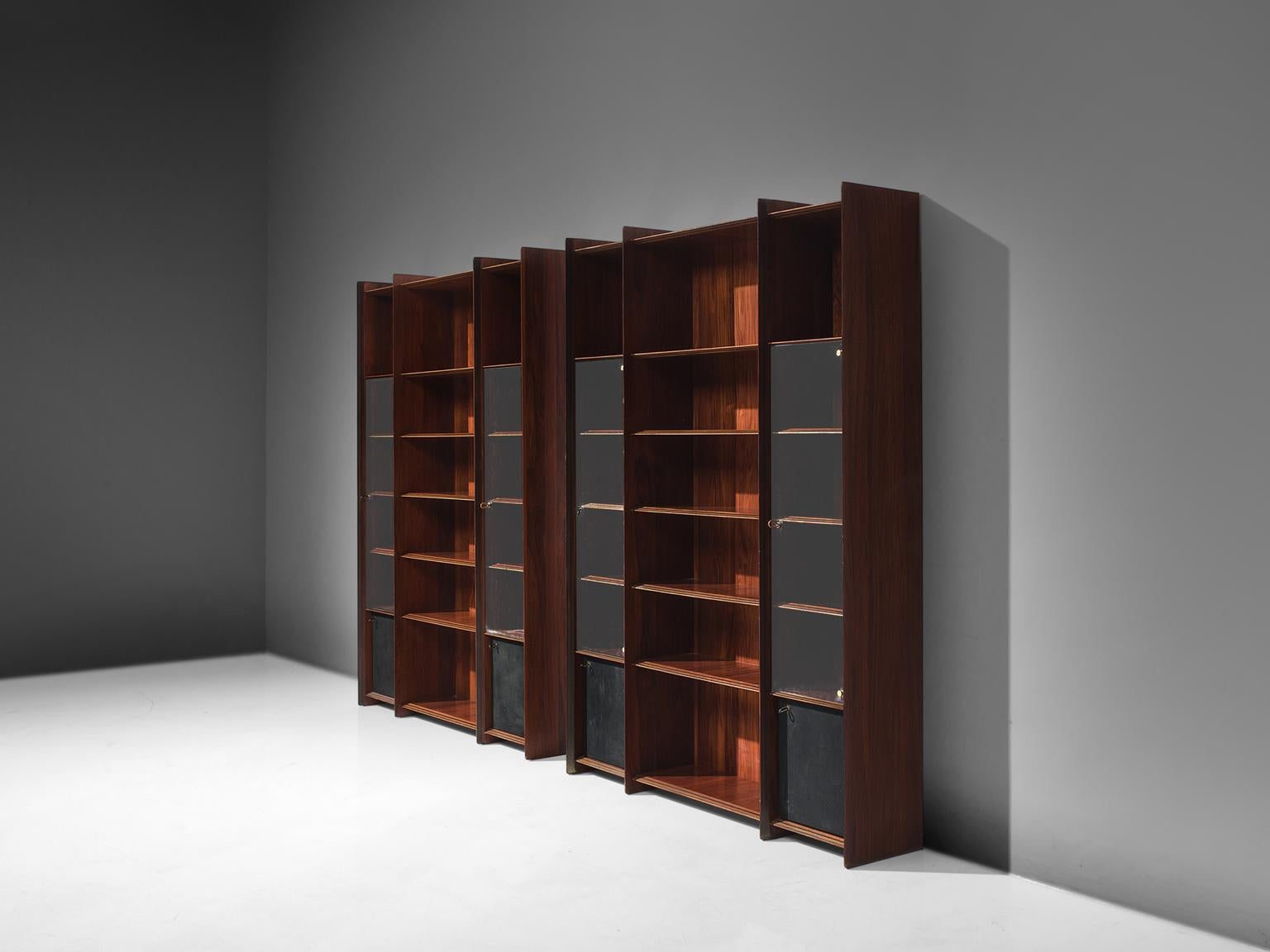 Afra & Tobia Scarpa, Artona cabinets, rosewood, glass and leather, Italy, circa 1975

These cabinets were designed during the first period of the Artona collection, it combines the characteristic solid striped rosewood and the use of a high