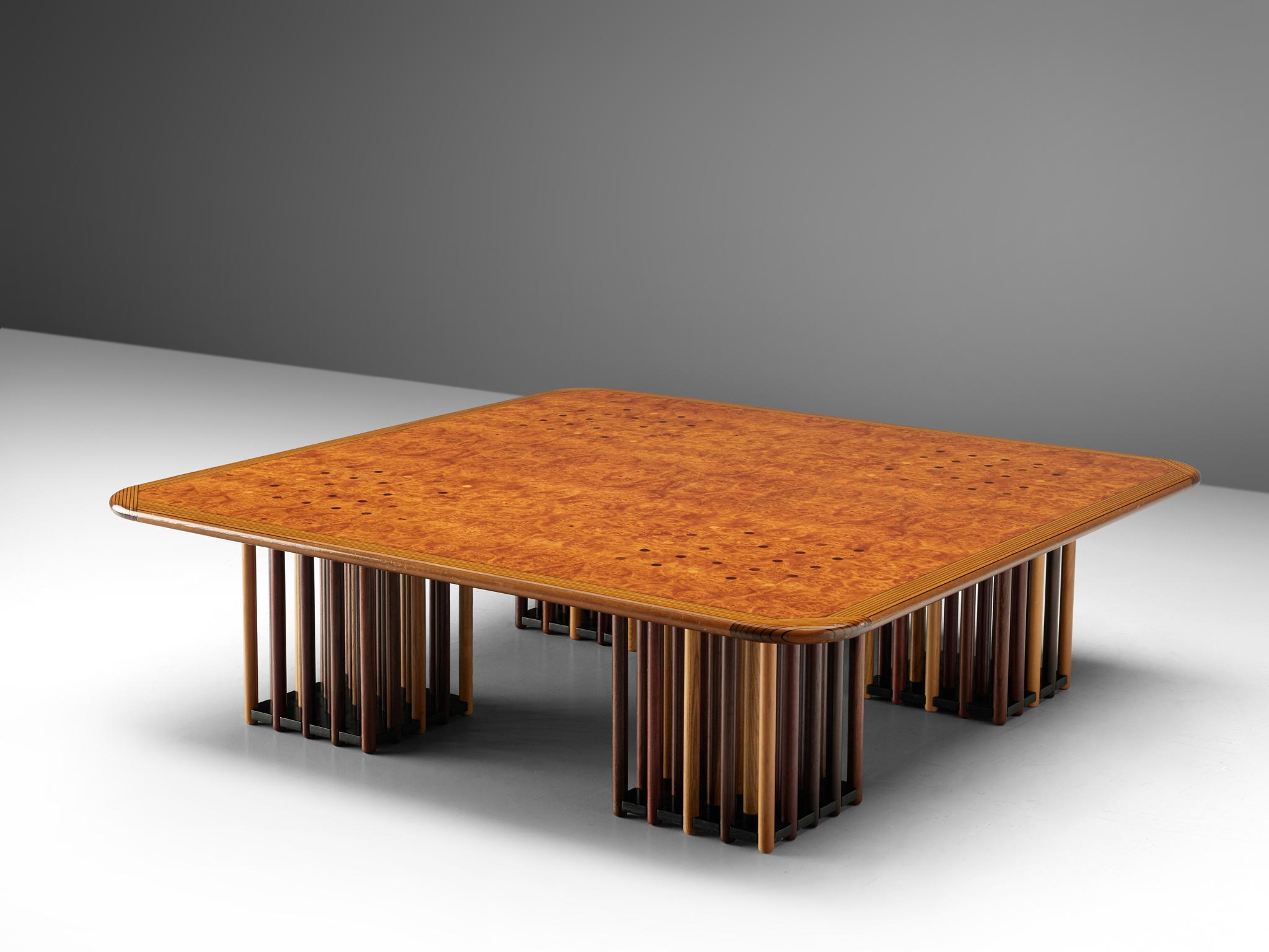 Coffee table by Afra Scarpa & Tobia Scarpa, maple, burl, birch, beech, oak, fruitwood, Italy, circa 1975.

This extraordinary square table features four feet that exist of circular rods made out of different types of wood. The ends of the circular
