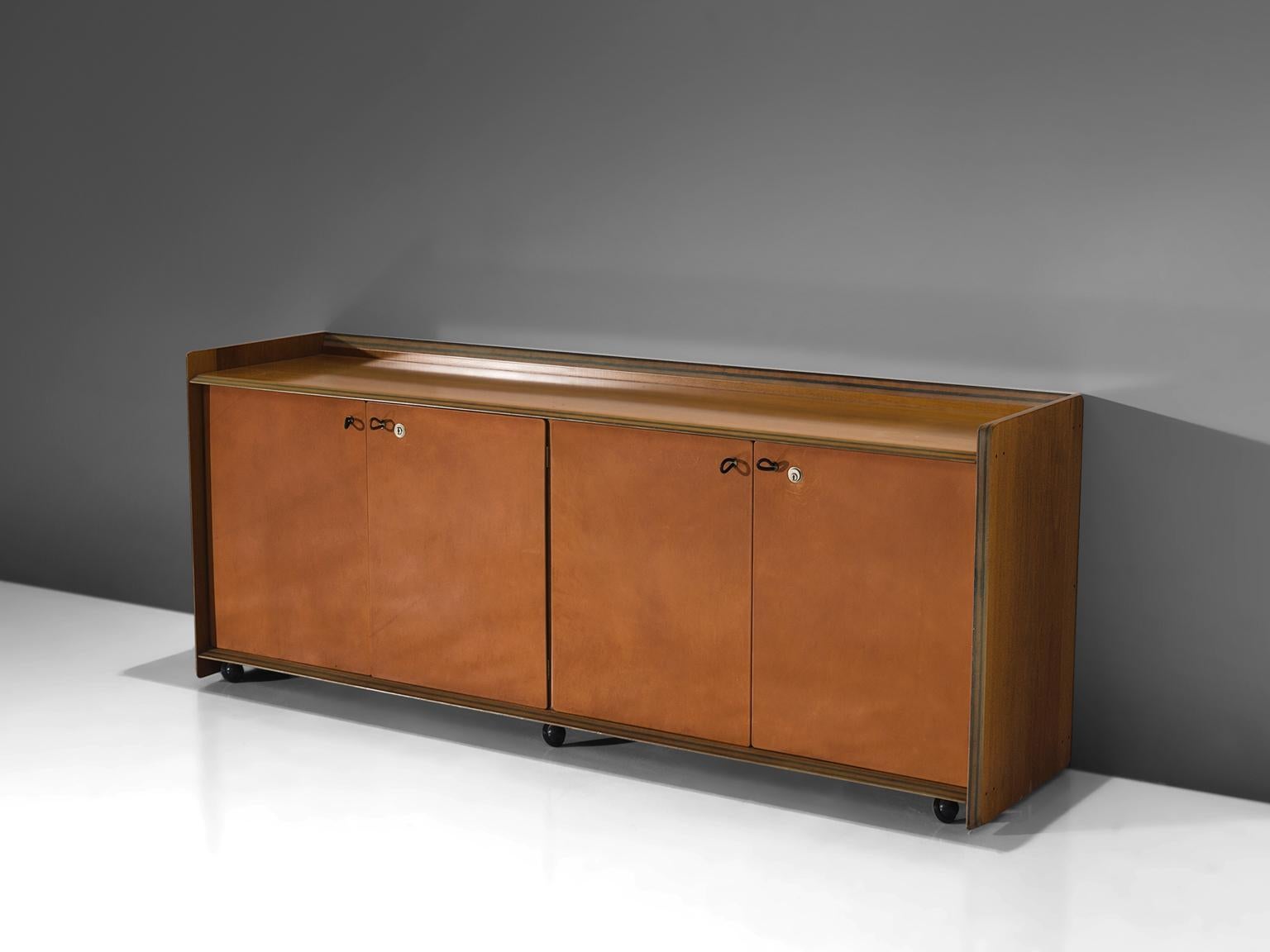 Afra & Tobia Scarpa, Artona cabinet, walnut and four leather doors, Italy, circa 1975

This sideboard with leather front is designed as part of the Artona line by The Artona line by the Scarpa duo was in fact the first line ever produced by