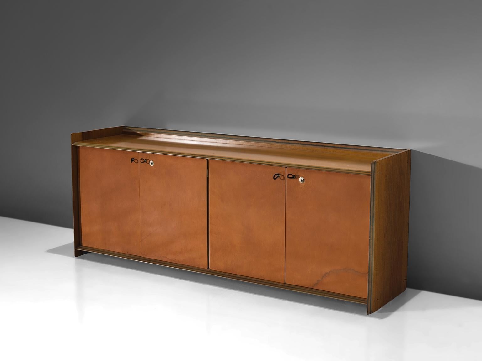 Afra & Tobia Scarpa, Artona cabinet, walnut and four leather doors, Italy, circa 1975

This sideboard with leather front is designed as part of the Artona line by The Artona line by the Scarpa duo was in fact the first line ever produced by Maxalto,