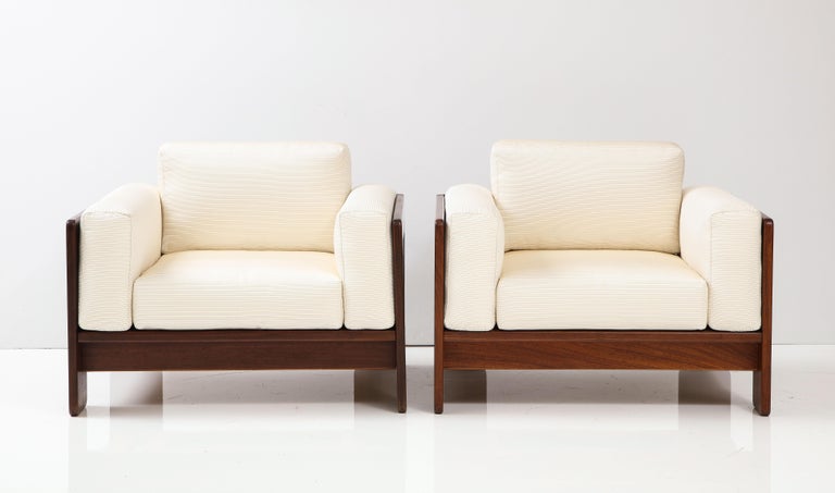 A classic and chic pair of club/lounge chairs from the Bastiano series, designed by the iconic Italian designer duo Afra & Tobia Scarpa for Gavina, Italy, circa 1960. The chairs have a solid rosewood frame and are newly upholstered with a cream