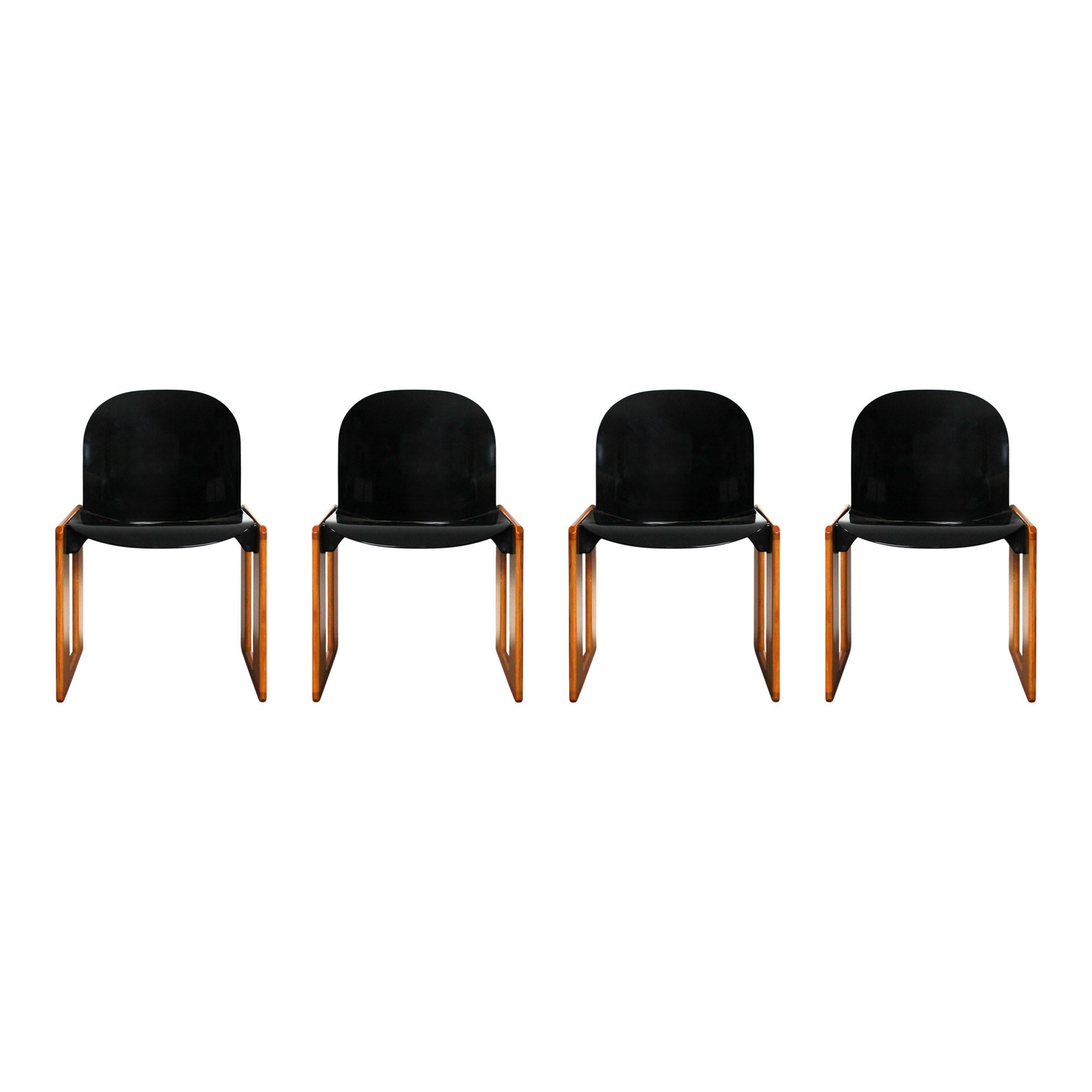 Set of four Dialogo Chairs Designed by Afra & Tobia Scarpa for B&B Italia, 1973

This set of four Dialogo chairs features:
- Natural beechwood structure
- Black lacquered plastic seat
- Signature Scarpa double trestle design

Excellent vintage