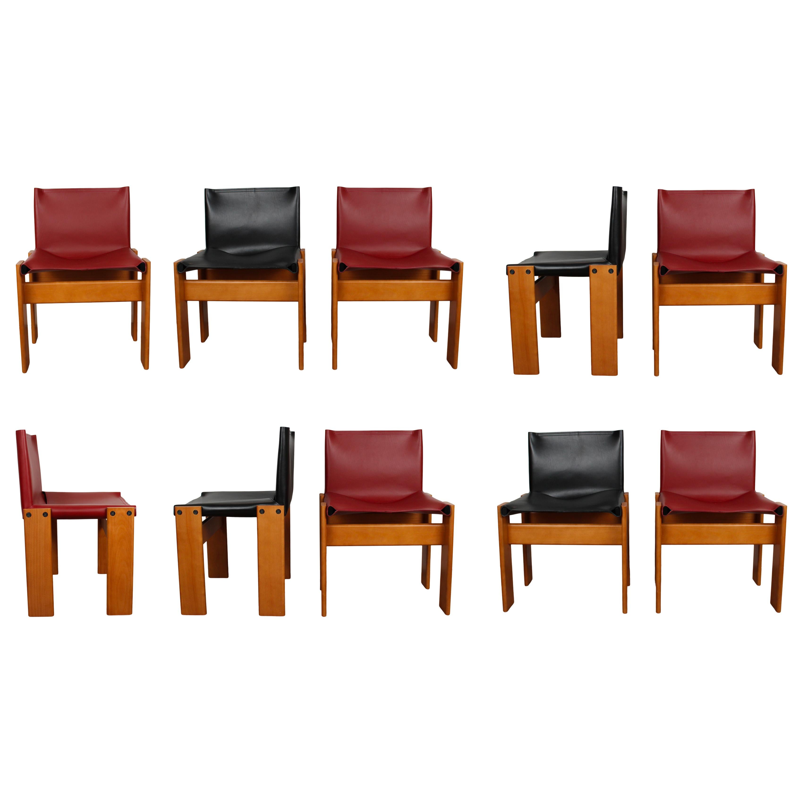 Set of ten “Monk” dining chairs designed by Afra and Tobia Scarpa for Molteni in 1973.
Made of English red and black leather and walnut.
Fully restored in Italy.

Interesting is the ‘flat’ shape of this chair where the designer has chosen to place