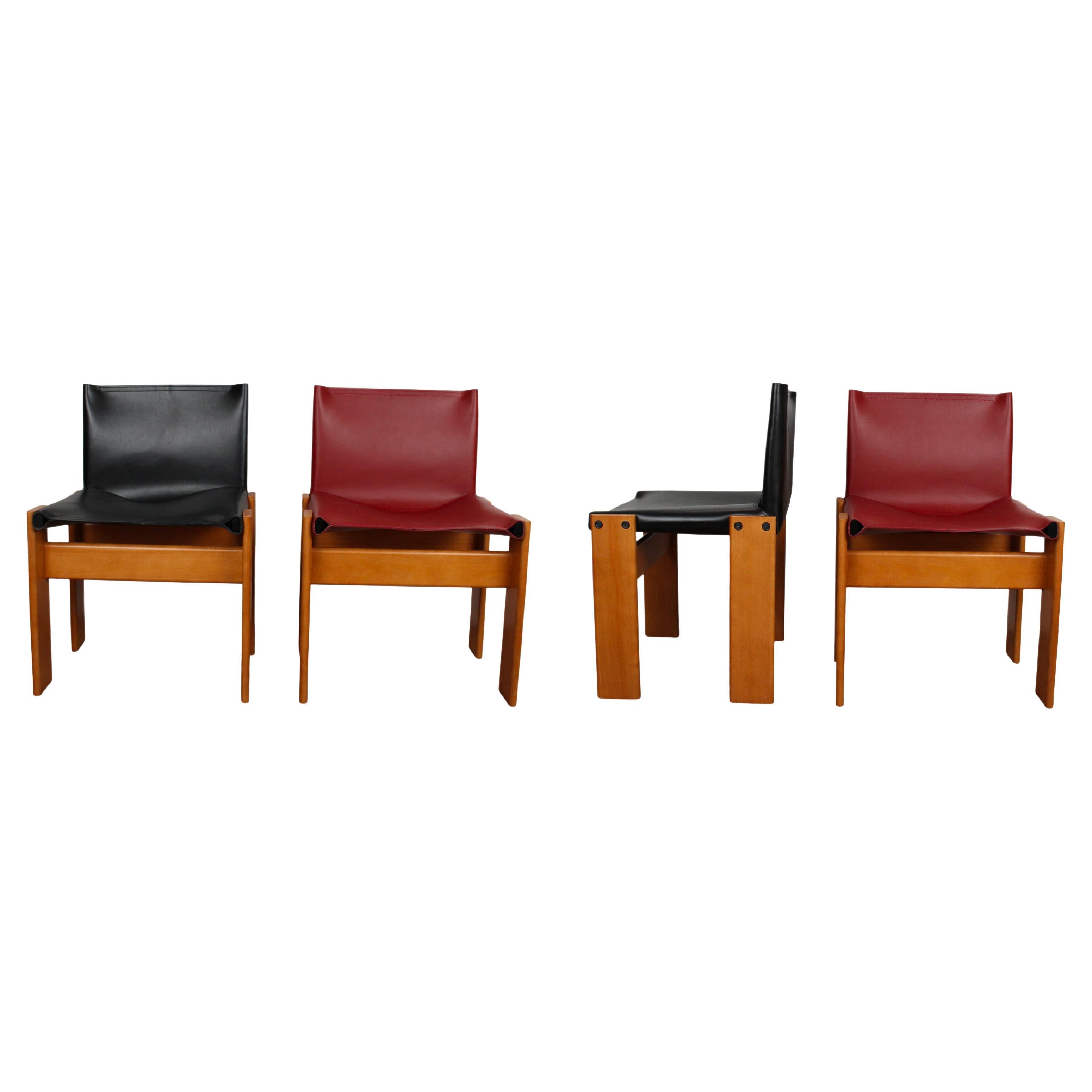 Set of four “Monk” dining chairs designed by Afra and Tobia Scarpa for Molteni in 1973.
Made of English red and black leather and walnut.
Fully restored in Italy.

Interesting is the ‘flat’ shape of this chair where the designer has chosen to place