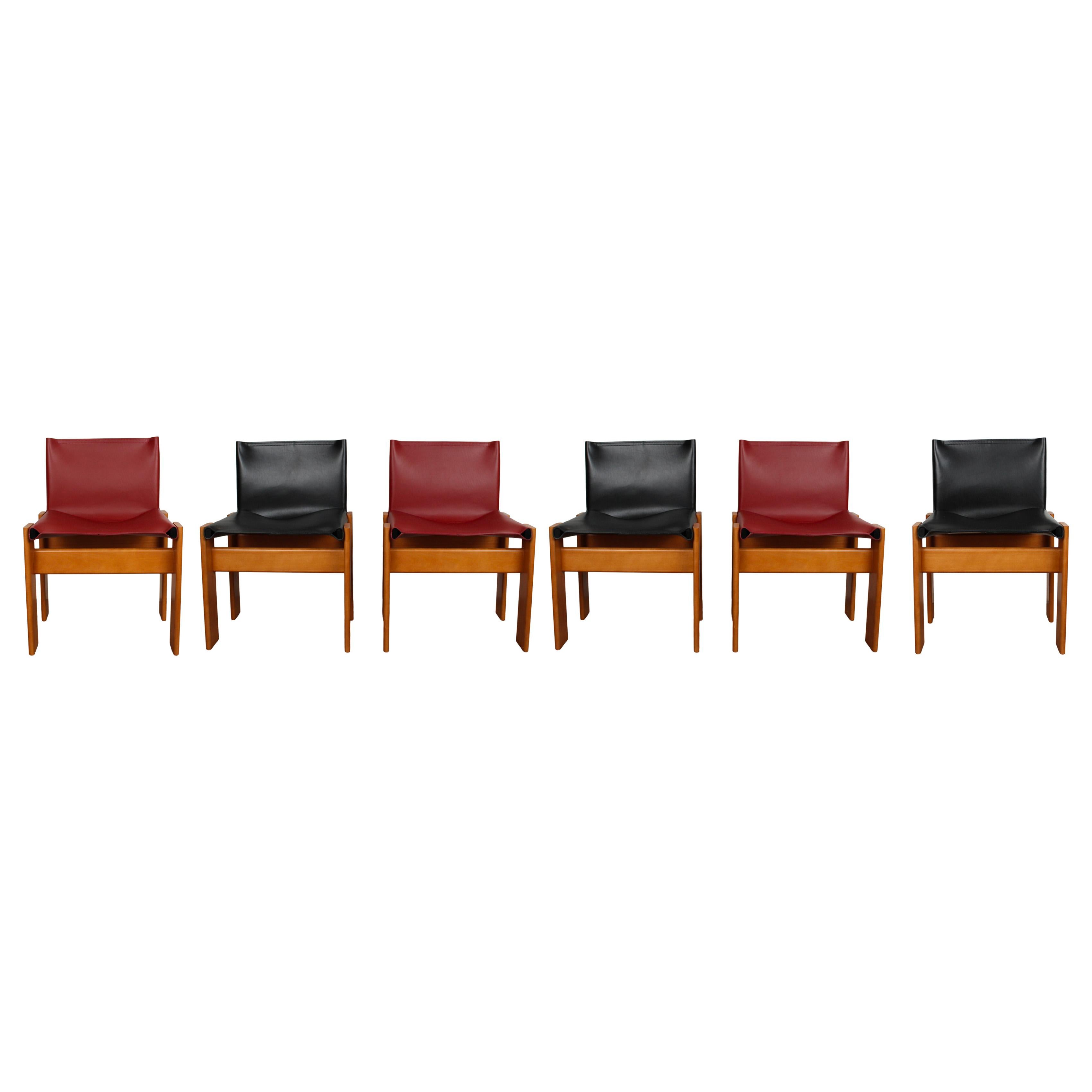 Set of six “Monk” dining chairs designed by Afra and Tobia Scarpa for Molteni in 1973.
Made of English red and black leather and walnut.
Fully restored in Italy.

Interesting is the ‘flat’ shape of this chair where the designer has chosen to place