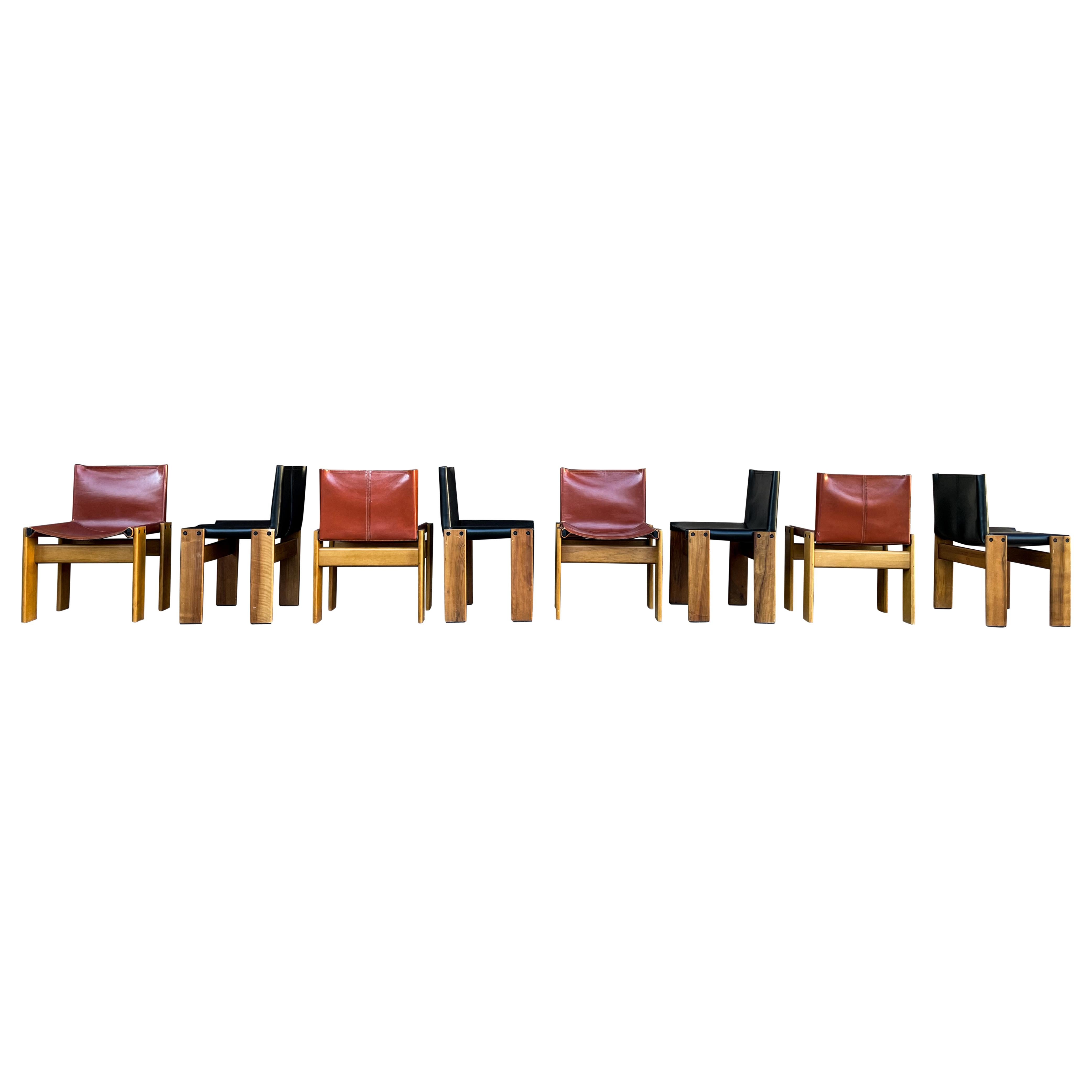 Set of eight “Monk” dining chairs designed by Afra and Tobia Scarpa for Molteni in 1973.

Made of black and brick leather and walnut.

Fully restored in Italy.

Interesting is the ‘flat’ shape of this chair where the designer has chosen to