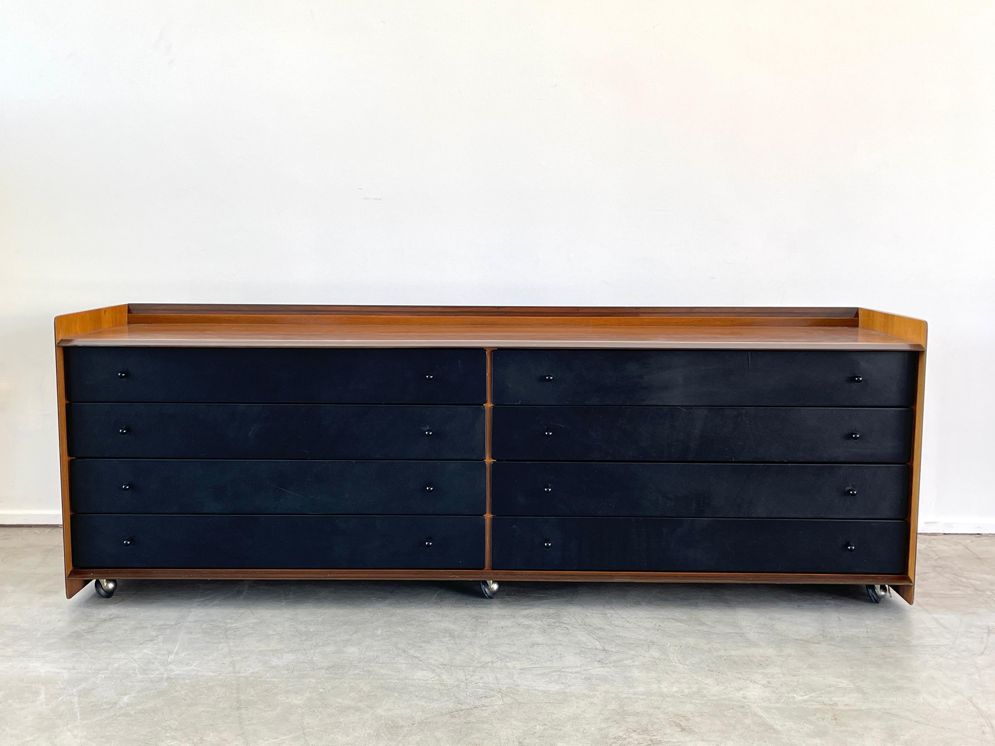 Chest of drawers by Afra & Tobia Scarpa in walnut and black leather drawers, Italy, circa 1970s 
Beautiful grain in walnut with wood inlay 
Cabinet sits on original chrome casters. 

