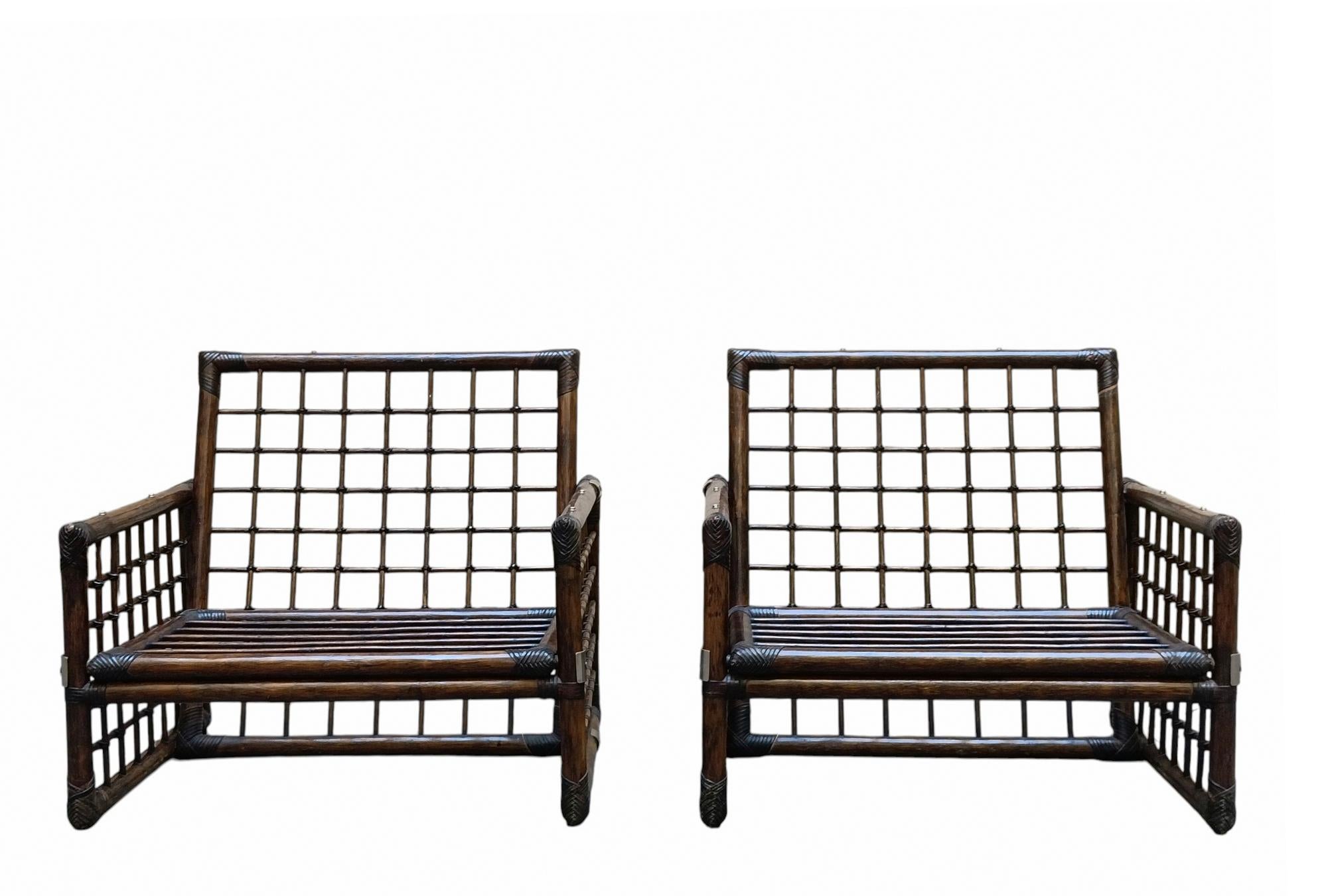 Paire de fauteuils de la série Basilan 
Rotin, laiton, reliures en cuir.
Prod. Philippine Company, une division de B&B Italia, vers 1975.
Bibliographie :
Domus n° 570, mai 1977, p. ad ; Giuliana Gramigna, Repertorio del Design Italiano 1950-2000 per