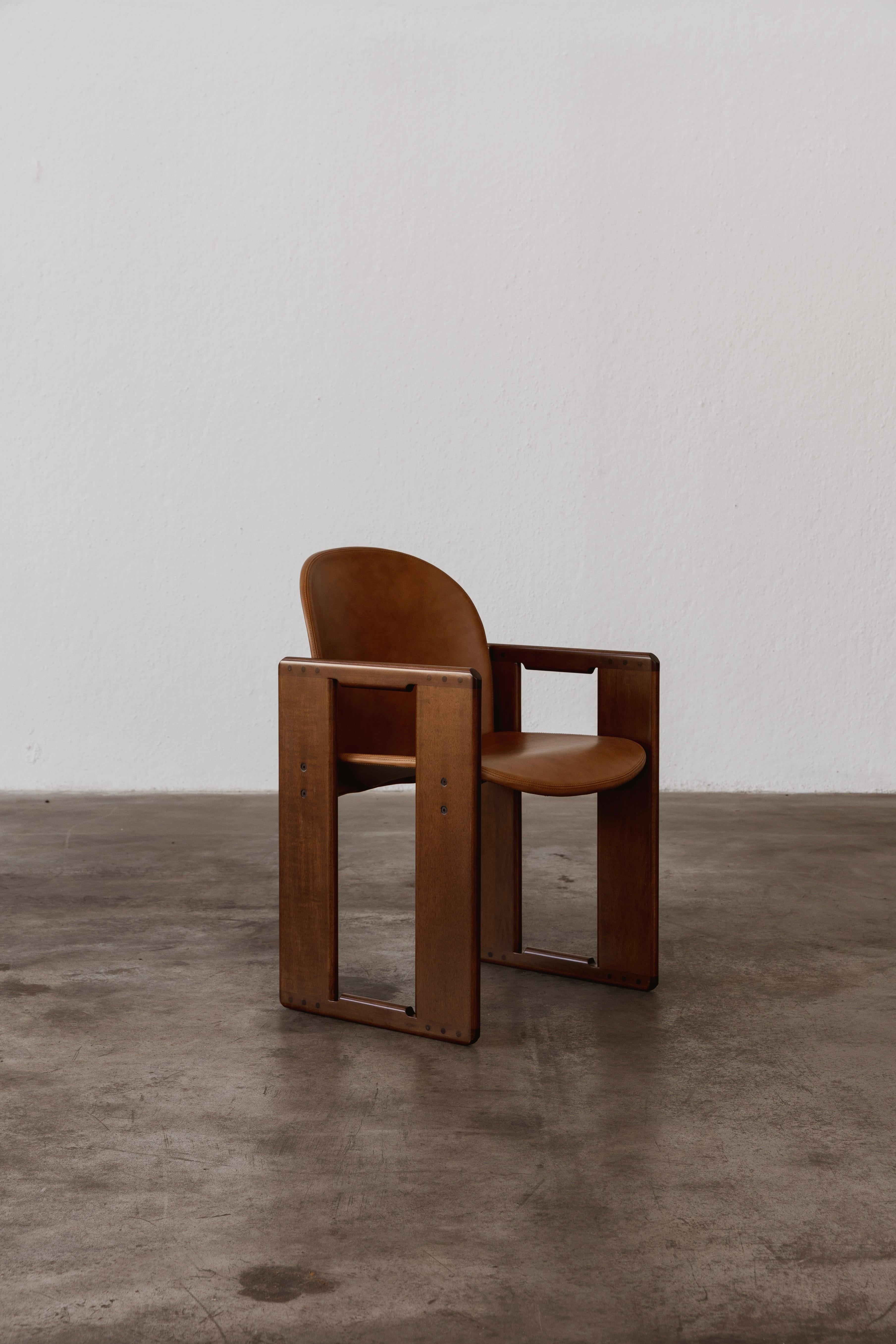 Afra & Tobia Scarpa “Dialogo” dining chair for B&B Italia, cognac leather and walnut, Italy, 1973.

The “Dialogo” chair is a return to the formal solution of the “121” chair. Once again, the double trestle structure with the characteristic rounded