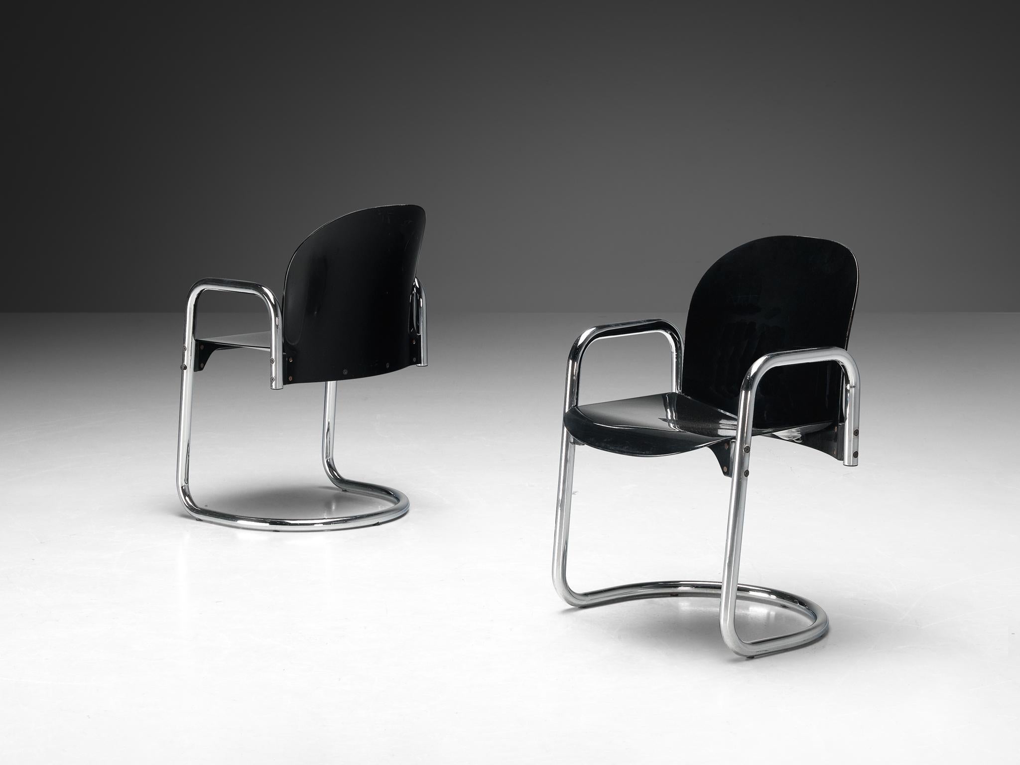 Afra and Tobia Scarpa for B&B Italia, 'Dialogo Dessau' dining chairs, chromed metal, plastic, Italy, 1974

The Dialogo Dessau chair, with its distinctive cantilevered base and integrated armrests, showcases the Scarpa duo's commitment to form and