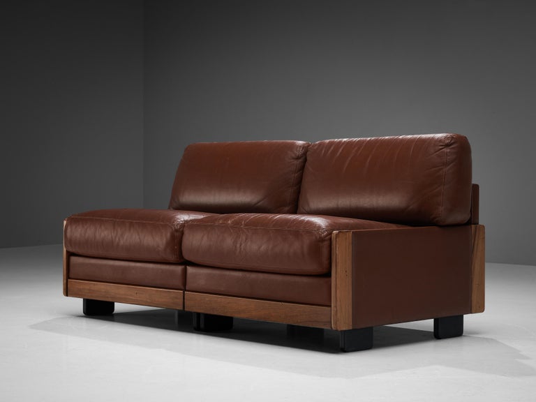 Afra & Tobia Scarpa for Cassina, two-seat sofa brown leather, walnut, Italy, 1966. 

This high quality settee is designed by Afra & Tobia Scarpa for Cassina in 1966. The design is bulky yet simple and very comfortable. A grand and majestic