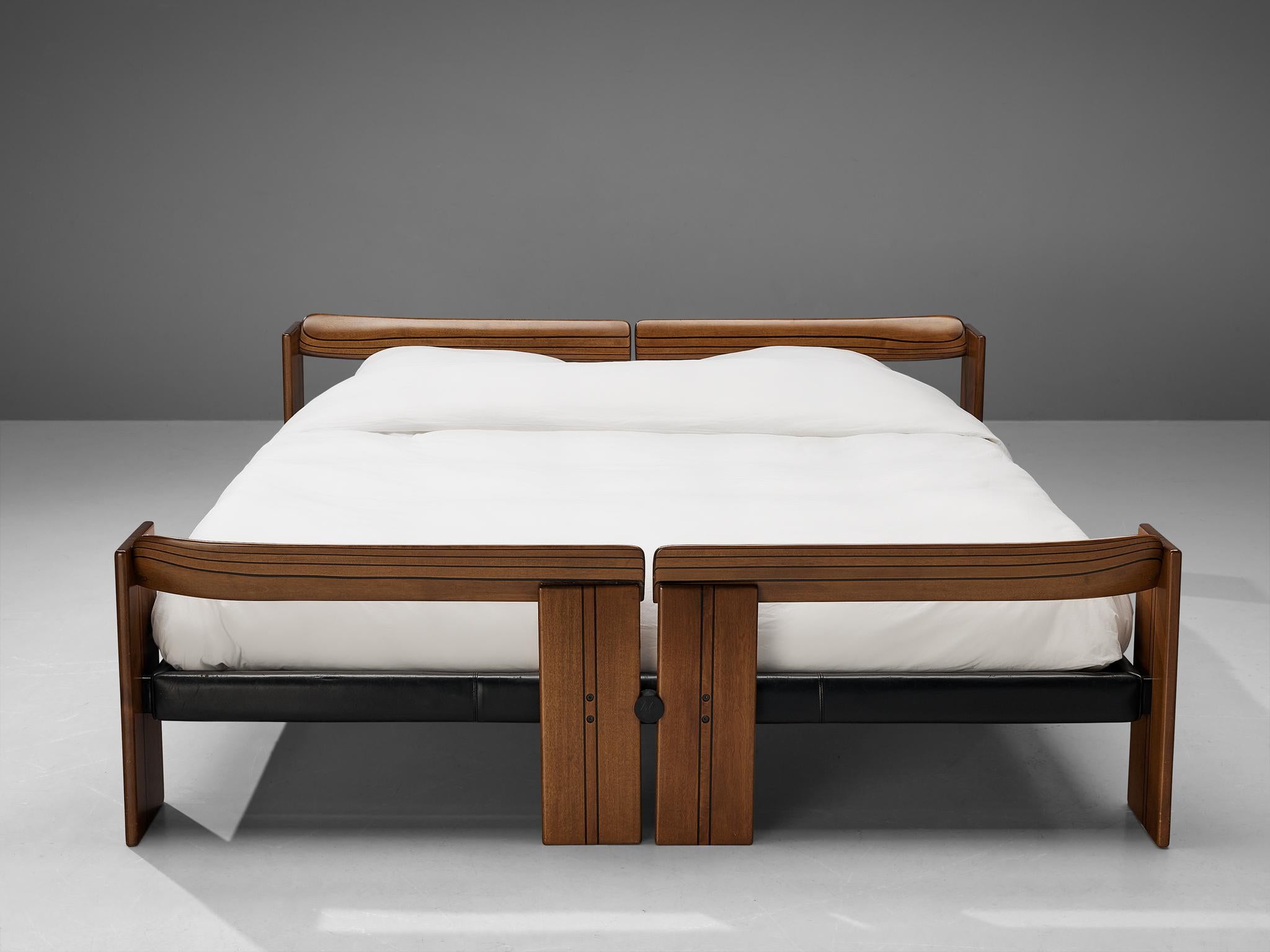 Afra & Tobia Scarpa for Maxalto, 'Artona' king bed, walnut, ebony, leather, Italy, 1975/1979

This well-designed bed convinces visually through its stabile construction accomplished by its remarkable geometrical shapes. The delicate ebony lines on