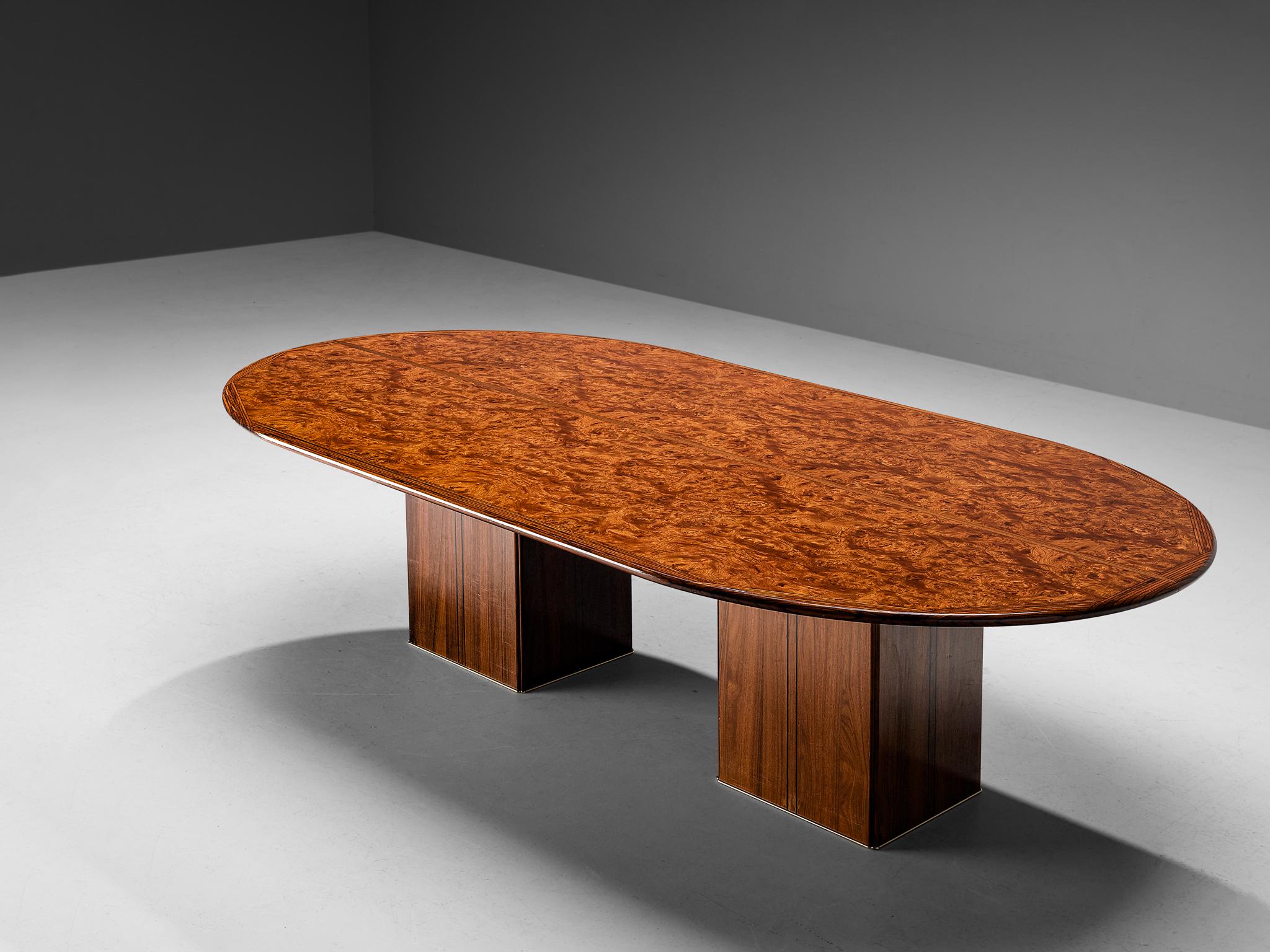 Afra & Tobia Scarpa for Maxalto, large oval dining table model ‘Artona’, walnut, walnut burl, ebony, brass, Italy, 1975/1979

Intriguing table designed by Afra and Tobia Scarpa. On two squared pedestal base rests an oval tabletop. The top shows