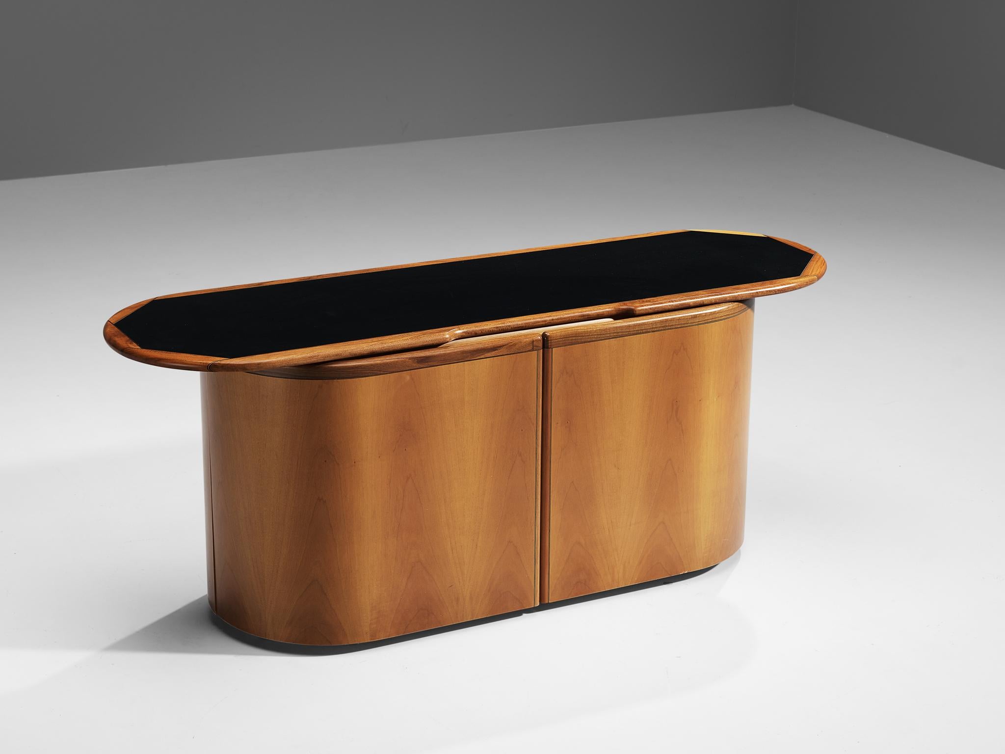 Afra & Tobia Scarpa for Maxalto, sideboard model ‘Artona’, walnut, ebony, glass, lacquered wood, Italy, 1975/1979

This cabinet was designed by Afra & Tobia Scarpa within the ‘Artona’ line for Maxalto. This particular model is rare. The round-shaped