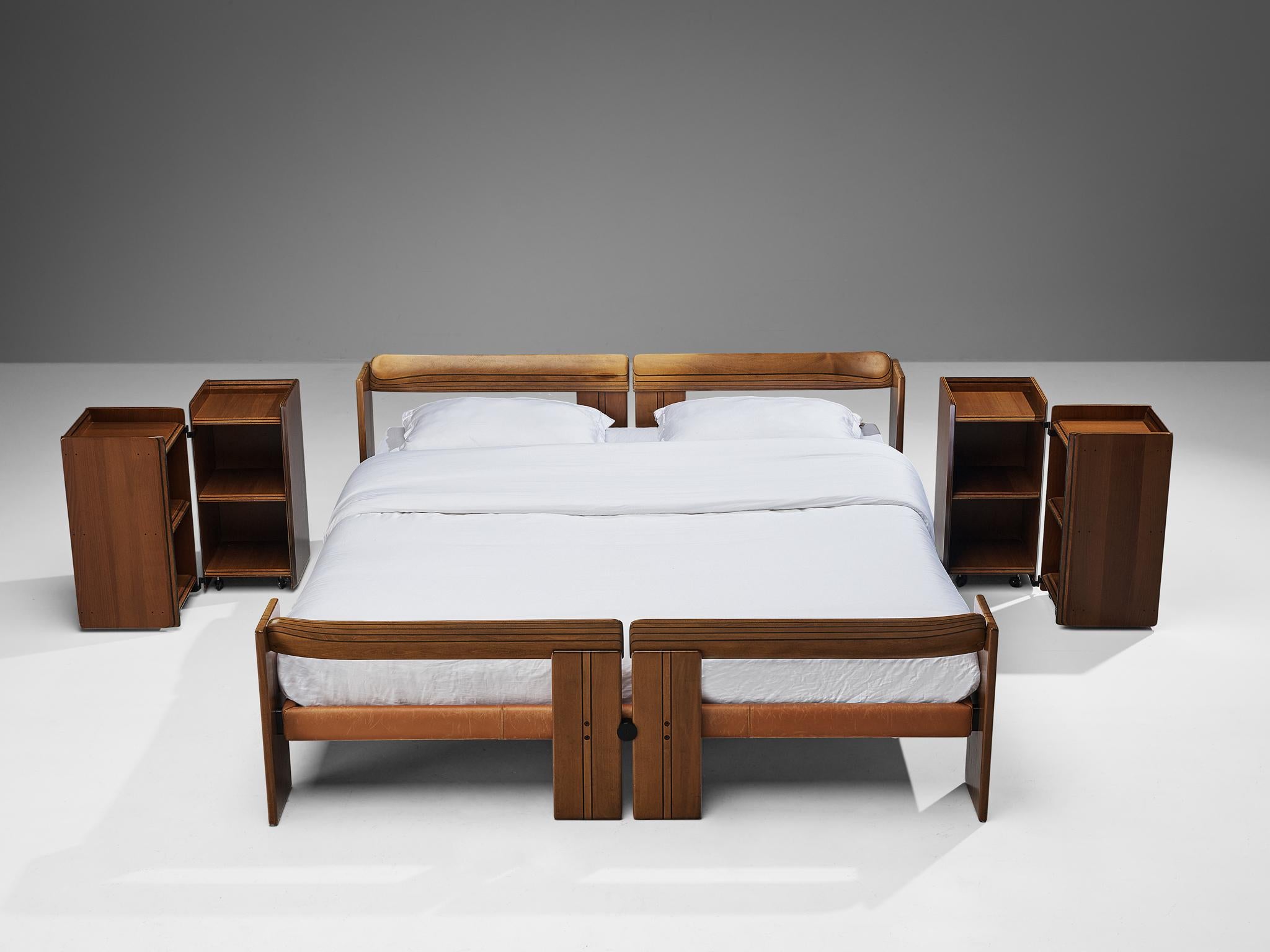 Afra & Tobia Scarpa, pair of 'Artona' nightstands, walnut and metal, Italy, circa 1975.

Pair of mobile cubic ‘Artona’ night stands by Italian designer couple Afra and Tobia Scarpa. A remarkable feature is that these items both consist out of two