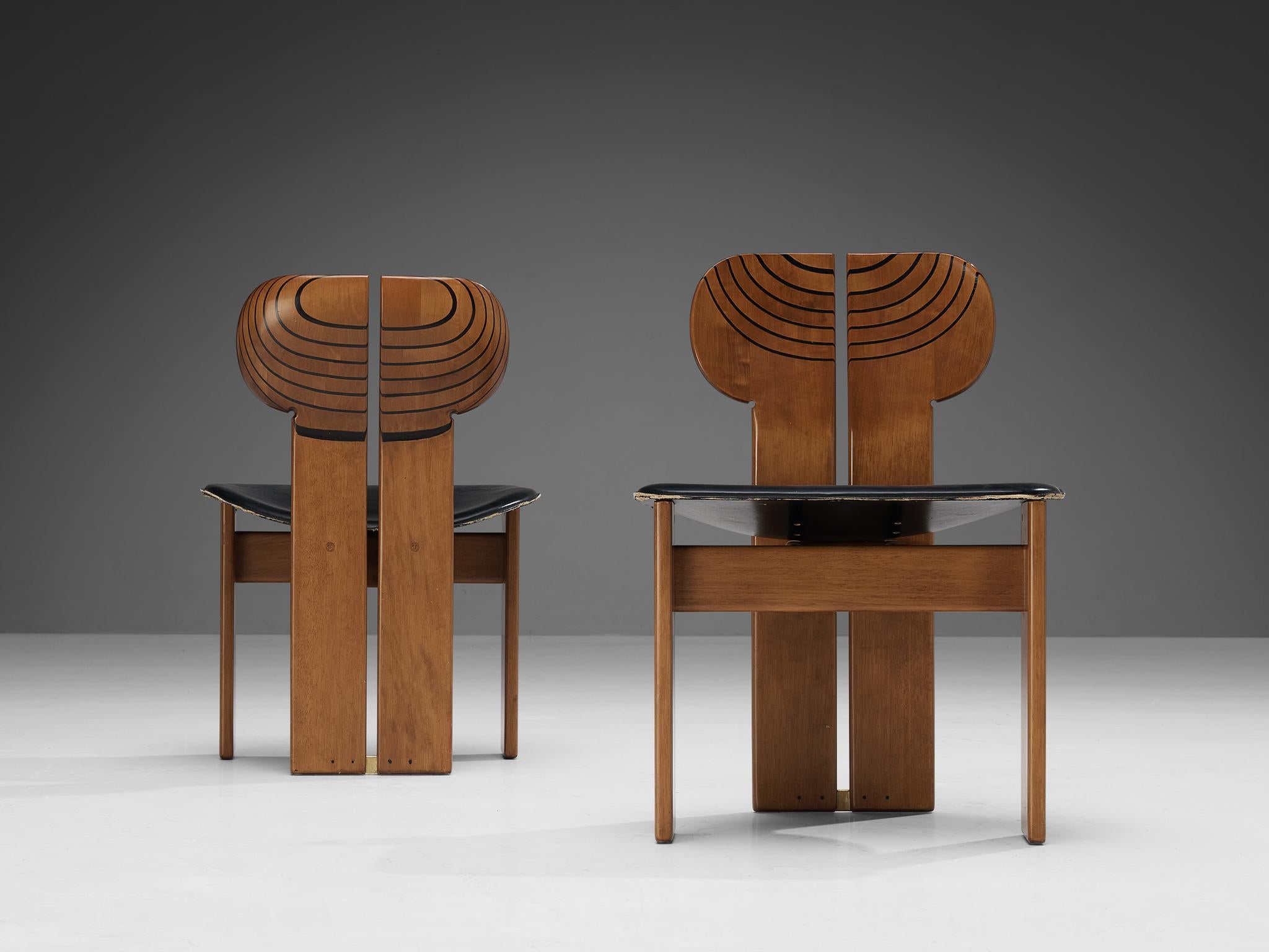 Afra & Tobia Scarpa for Maxalto, pair of dining chairs, model 'Africa', leather, walnut, ebony, brass, Italy, 1975

Sculptural pair of 'Africa' dining chairs designed by Afra & Tobia Scarpa. This model is part of the Artona collection by Italian
