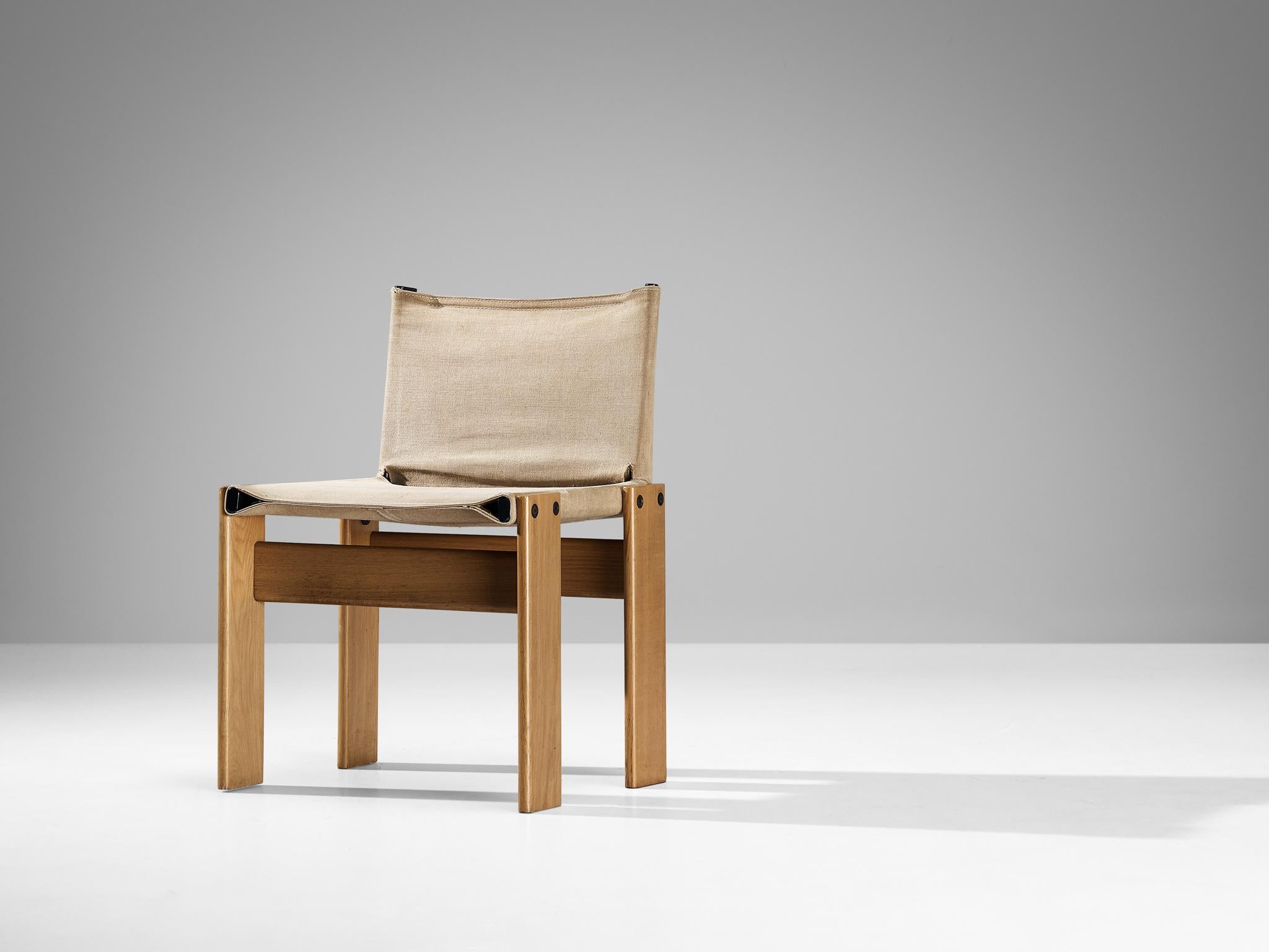 Afra & Tobia Scarpa for Molteni, 'Monk' dining chair, oak, canvas, steel, plastic, Italy, 1974.

The beige canvas forms a striking combination with the oak wood. Interesting is the 'flat' shape of this chair where the designer has chosen to place