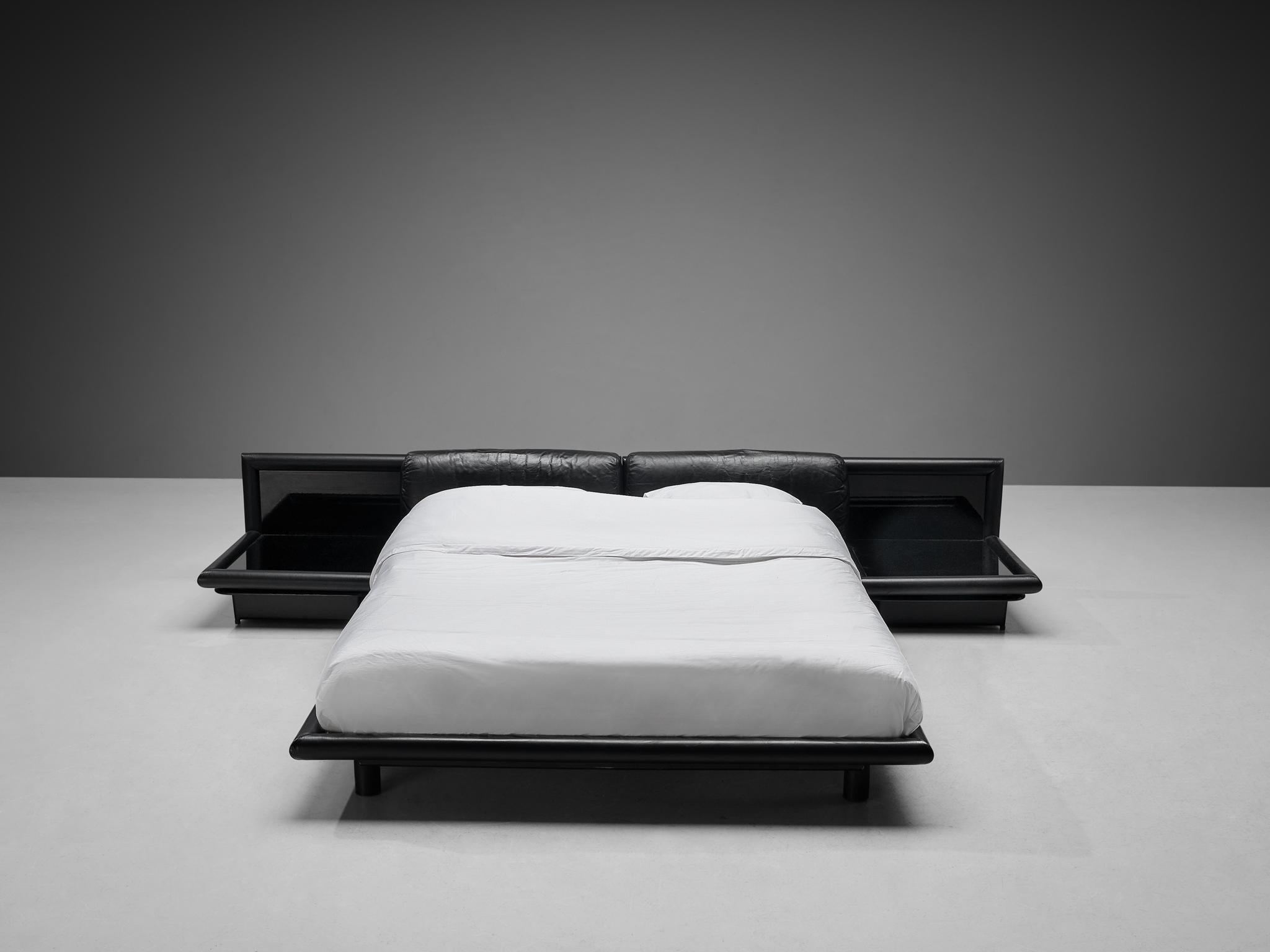 Afra & Tobia Scarpa for Molteni, bed with nightstands model ‘Morna’, leather, opaline glass, wood, plastic, Italy, designed in 1972 

This rare bed named ‘Morna’ reflects the duo’s signature design style and the transition to the modern bedroom in