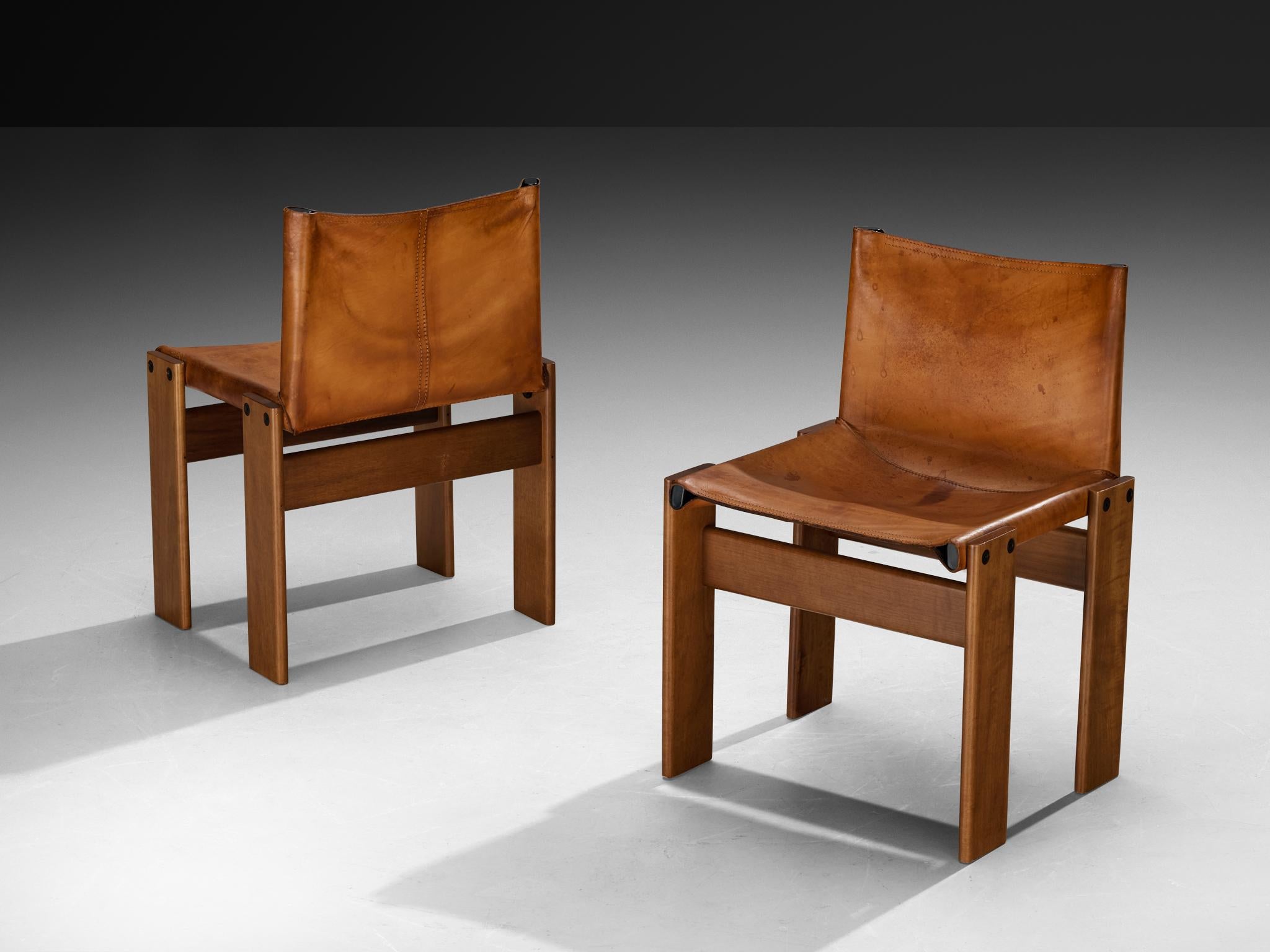 Afra & Tobia Scarpa for Molteni, pair of 'Monk' dining chairs, walnut, patinated leather, Italy, 1974.

Pair of 'Monk' chairs by Italian designers Afra & Tobia Scarpa. The cognac leather forms a striking combination with the warm tone of the walnut