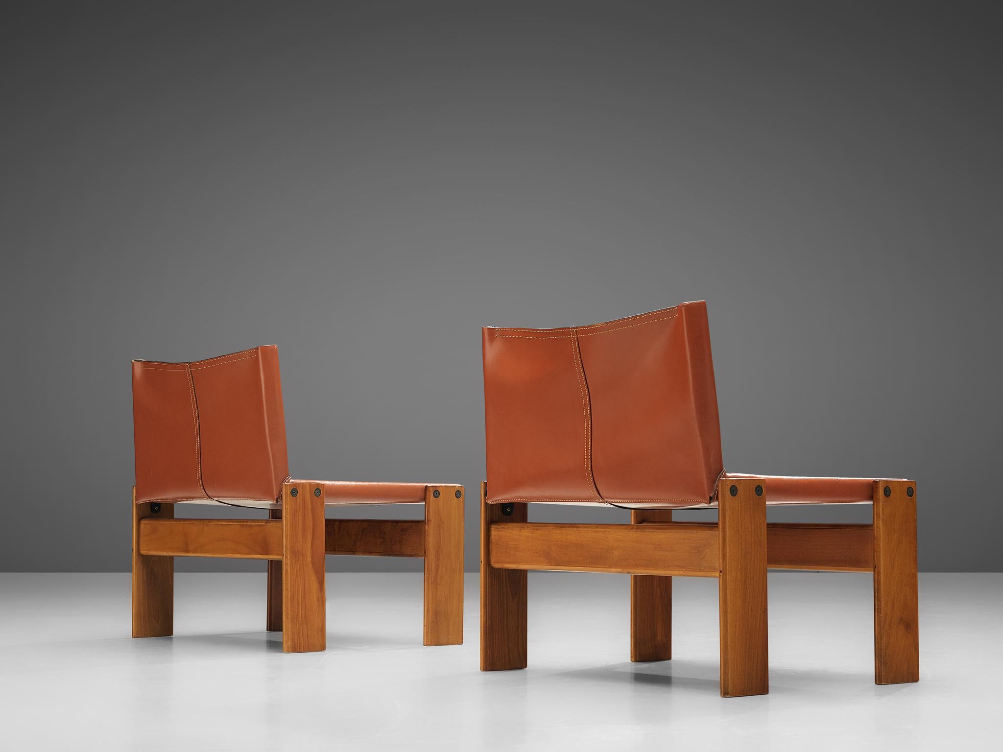 Afra & Tobia Scarpa for Molteni, pair of 'monk' lounge chairs, beech and cognac leather, Italy, 1970s

This version of the 'Monk' chair by Afra & Tobia Scarpa is a lower model with a wider seat. The wonderfully cognac leather forms a striking
