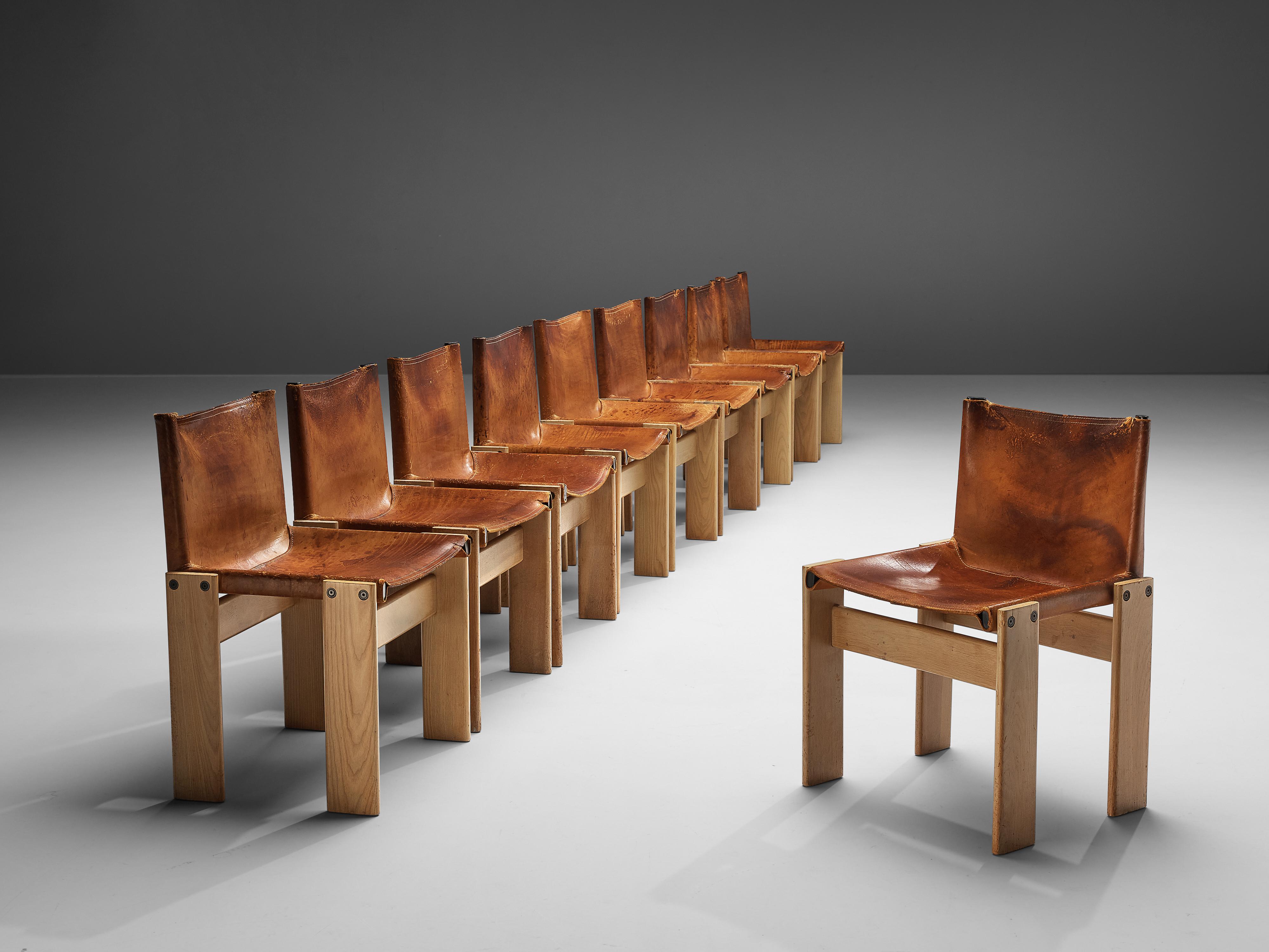 Afra & Tobia Scarpa for Molteni, ten 'monk' dining chairs, patinated beech, patinated ash, cognac leather, Italy, 1974

The wonderfully deep cognac leather forms a striking combination with the blond wood. Interesting is the 'flat' shape of this