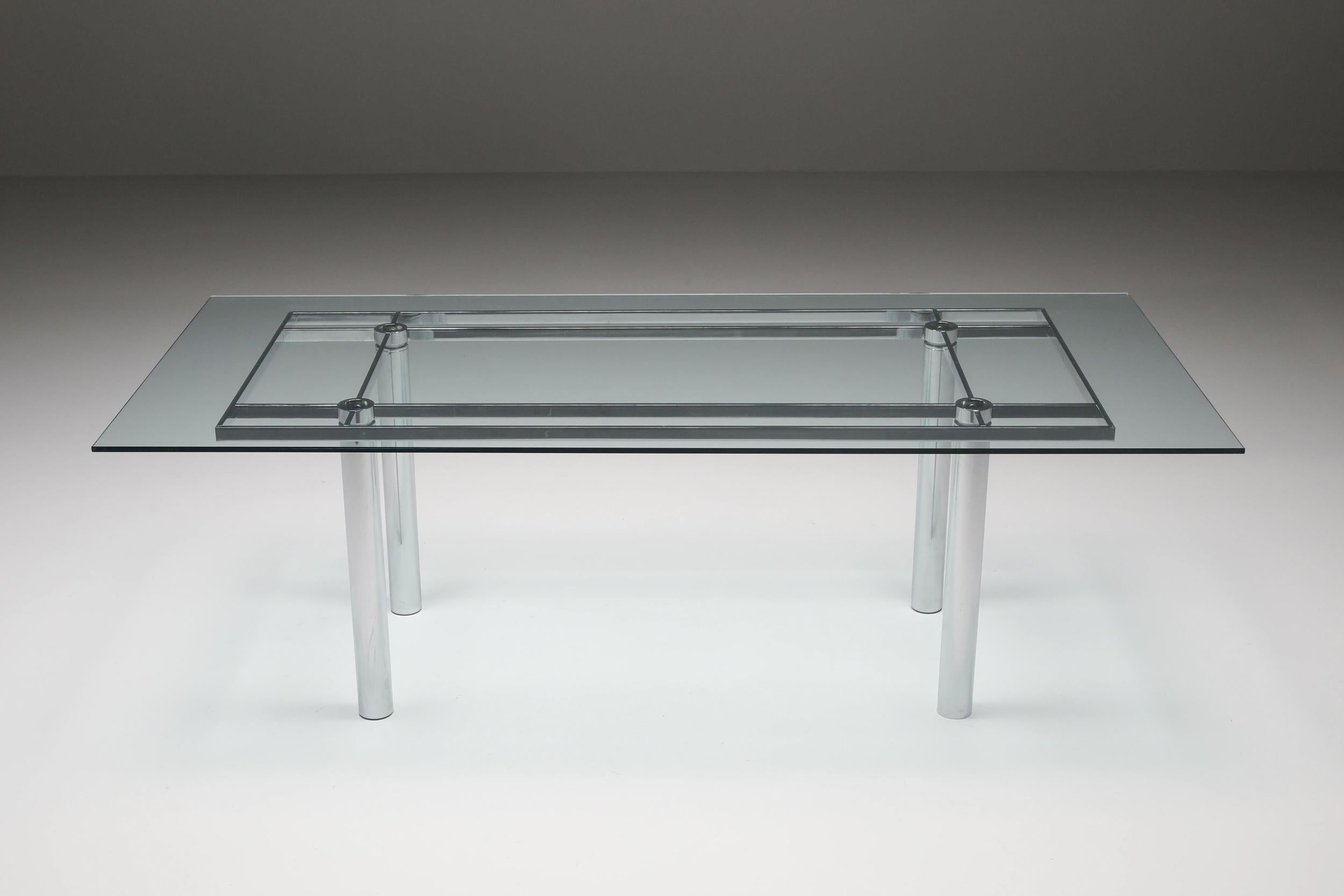 Afra & Tobia Scarpa glass & chrome dining table; Italian design; Compasso d'Oro Award; B&B Italia; International Forum Design Hanover Award;

Afra & Tobia Scarpa designed a glass and chrome steel framed dining table with cross details. An elegant