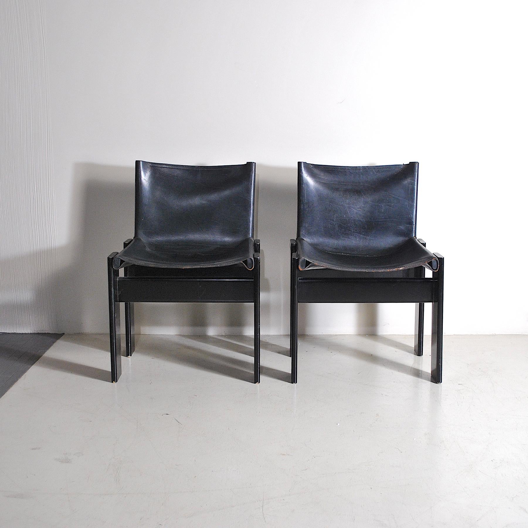 Pair of seats model Monk designer Afra & Tobia Scarpa for Molteni is made with walnut structure with black leather seat, normal signs of wear due to use and time.
