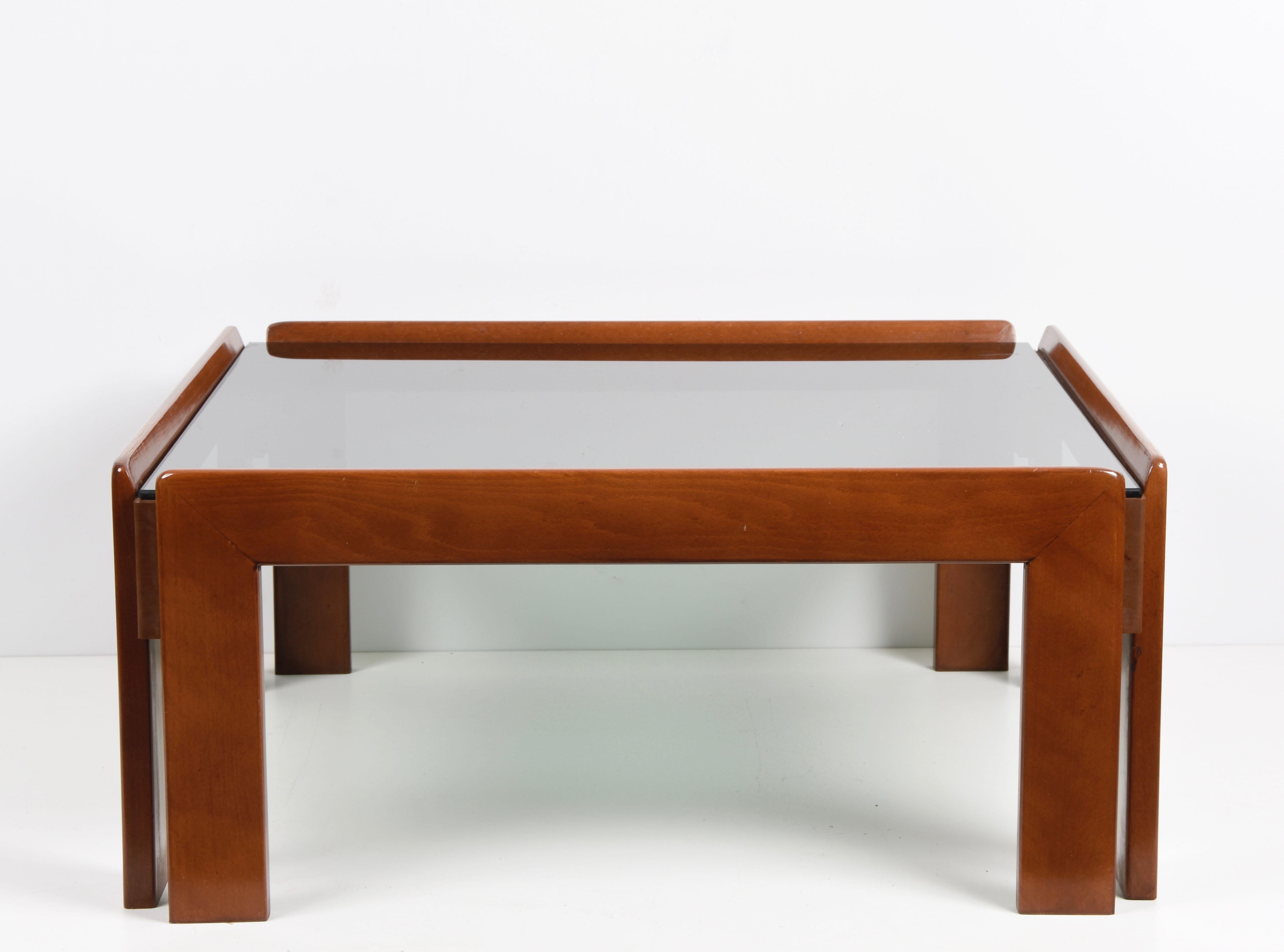Midcentury incredible squared solid wood coffee table with smoked glass top. It was produced in Italy in the 1960s by Cassina and designed by Afra & Tobia Scarpa.

You are going to love the clean lines and the presence of the dark-toned, smoked