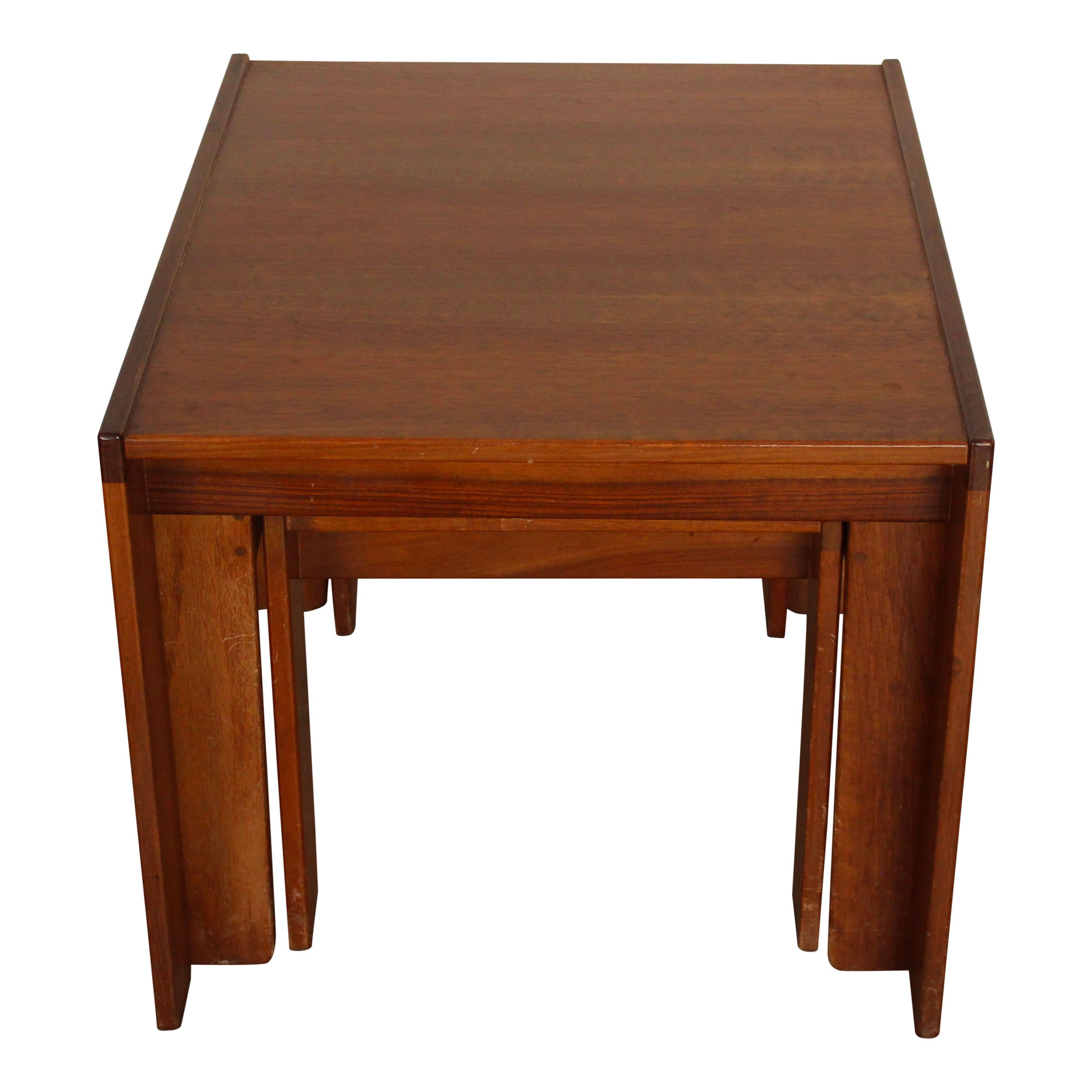 Model 777 extractable coffee tables, designed by Afra and Tobia Scarpa for Cassina in 1965.
Made of walnut.
Excellent vintage condition.

They are three coffee tables of different sizes, each designed to nest within the other. The tables feature two