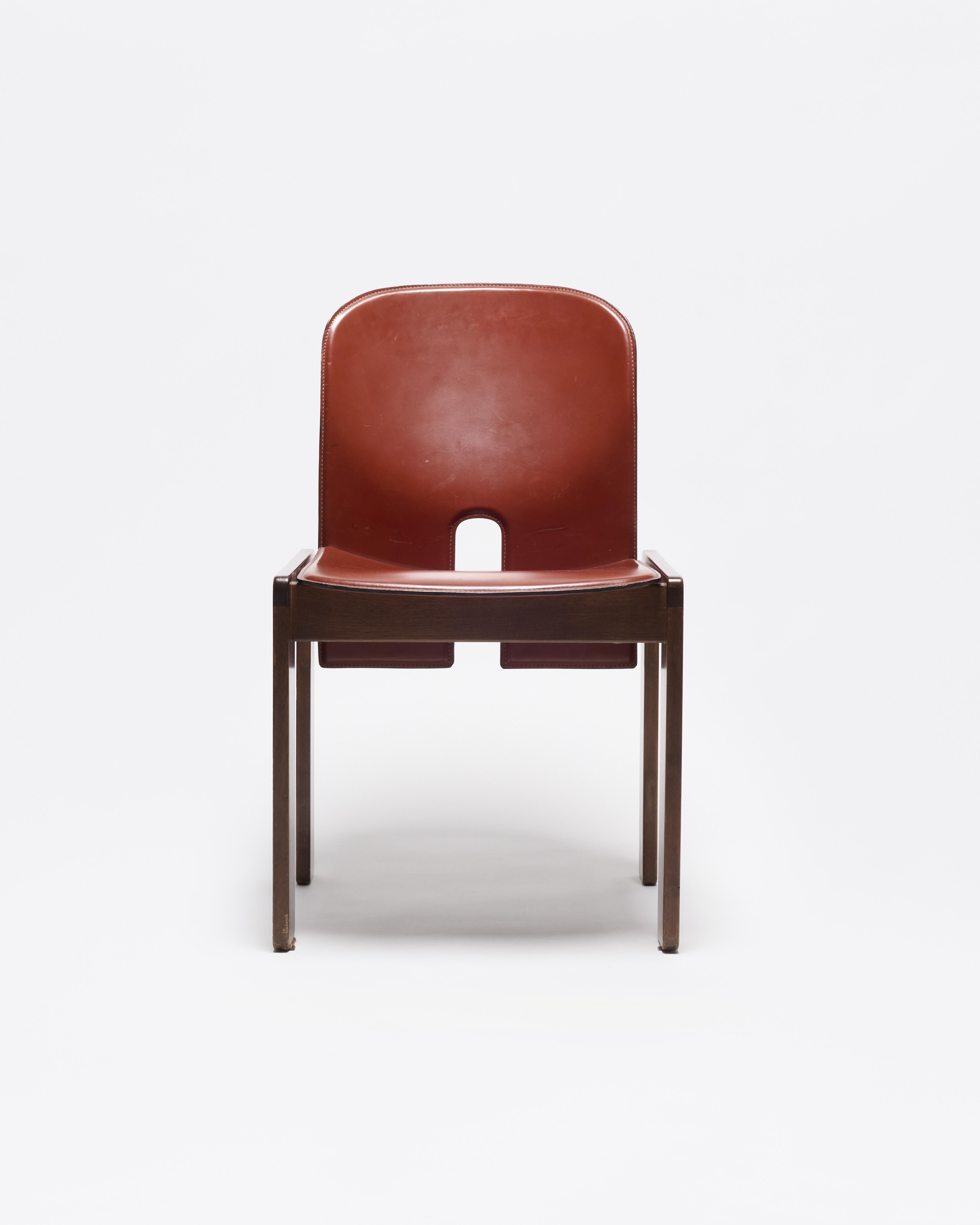 Designed by the husband-and-wife duo Afra and Tobia Scarpa for Cassina, the 121 dining chair embodies their signature approach. Blending architectural rigor with sensuous materiality.

The sculptural frame features subtle joinery details and