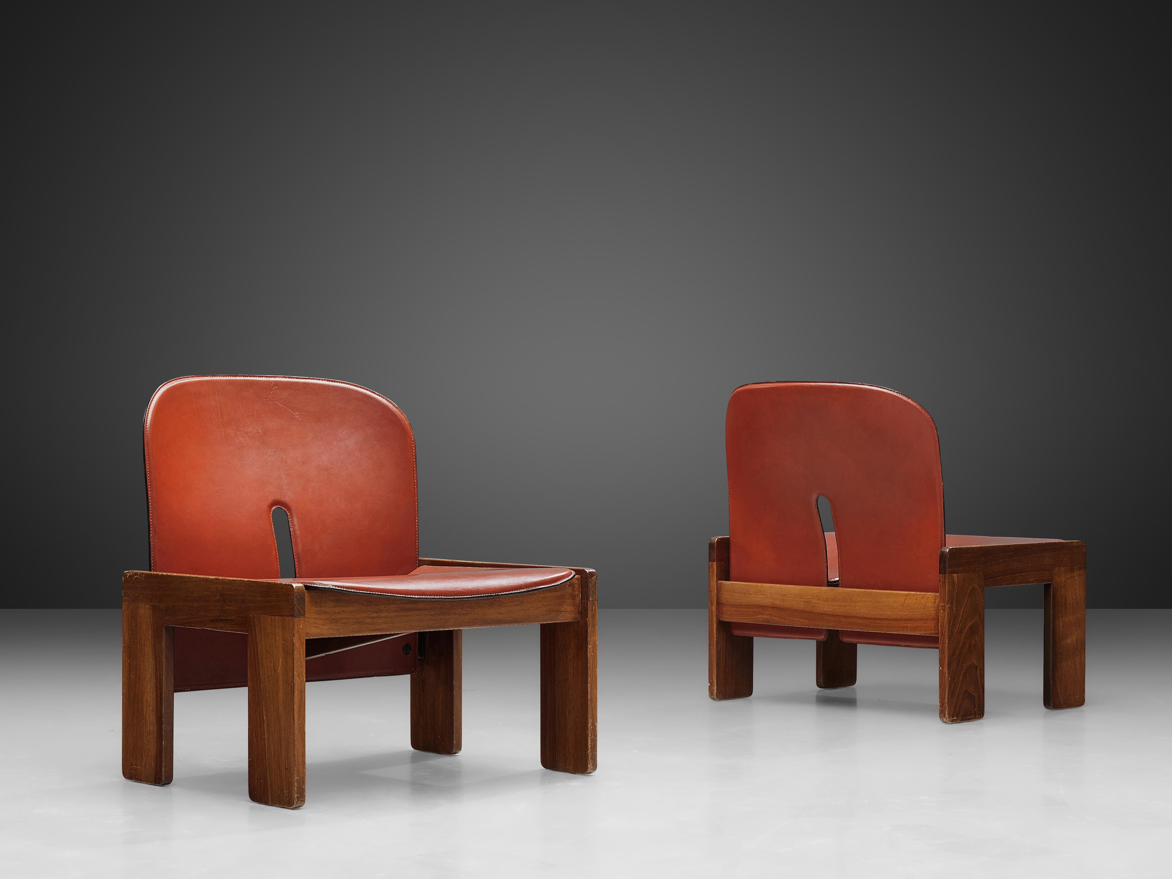 Afra & Tobia Scarpa for Cassina, pair of '925' easy chairs, walnut and leather, Italy, 1966

Two '925' lounge chairs by Italian designer couple Tobia and Afra Scarpa. These low chairs have a cubic and architectural appearance. The base consist of