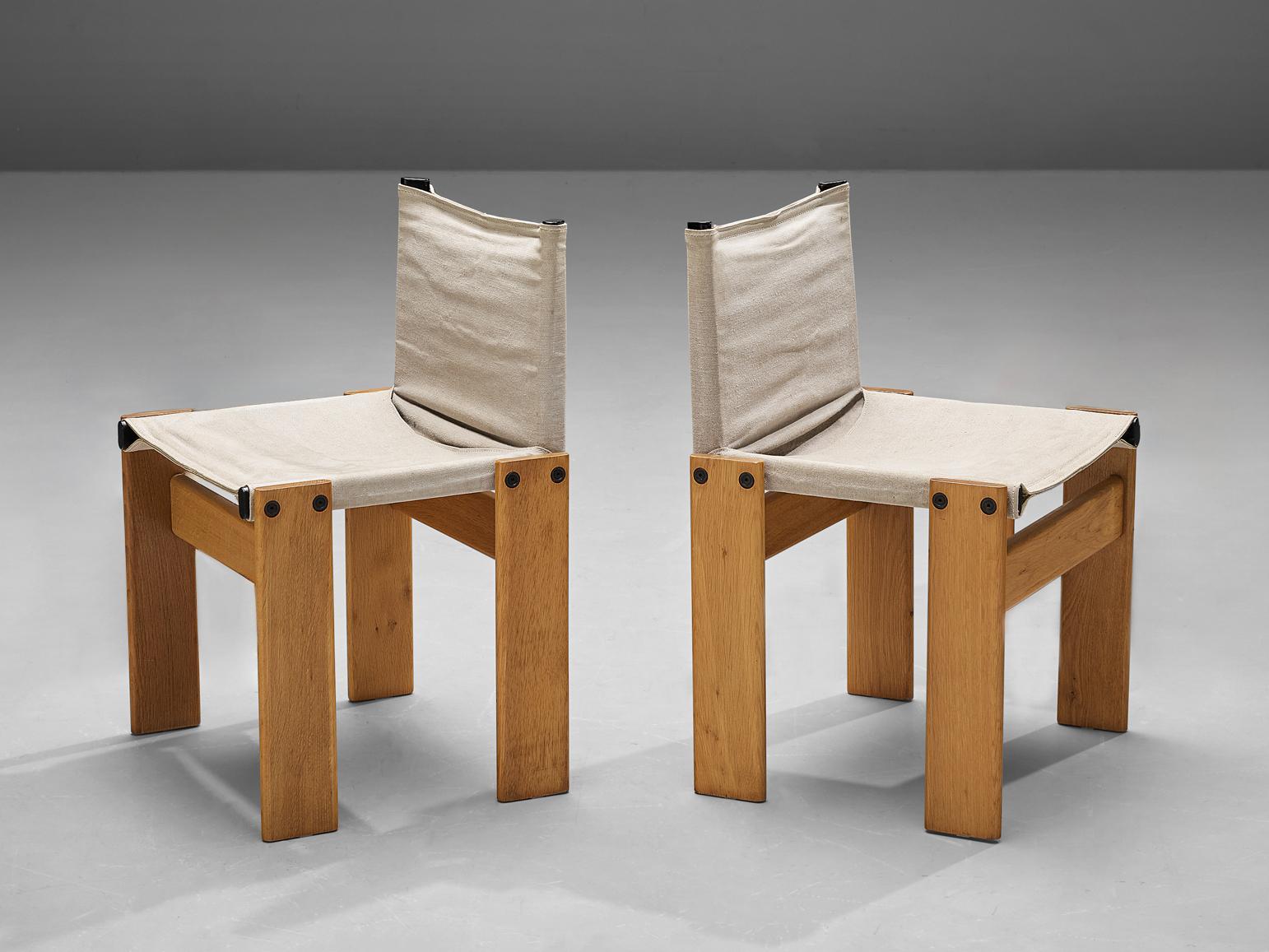Afra & Tobia Scarpa for Molteni, pair of 'Monk' dining chairs, oak, canvas, Italy, designed in 1974 

The light canvas forms a striking combination with the blond wood. Interesting is the 'flat' shape of this chair where the designer has chosen to