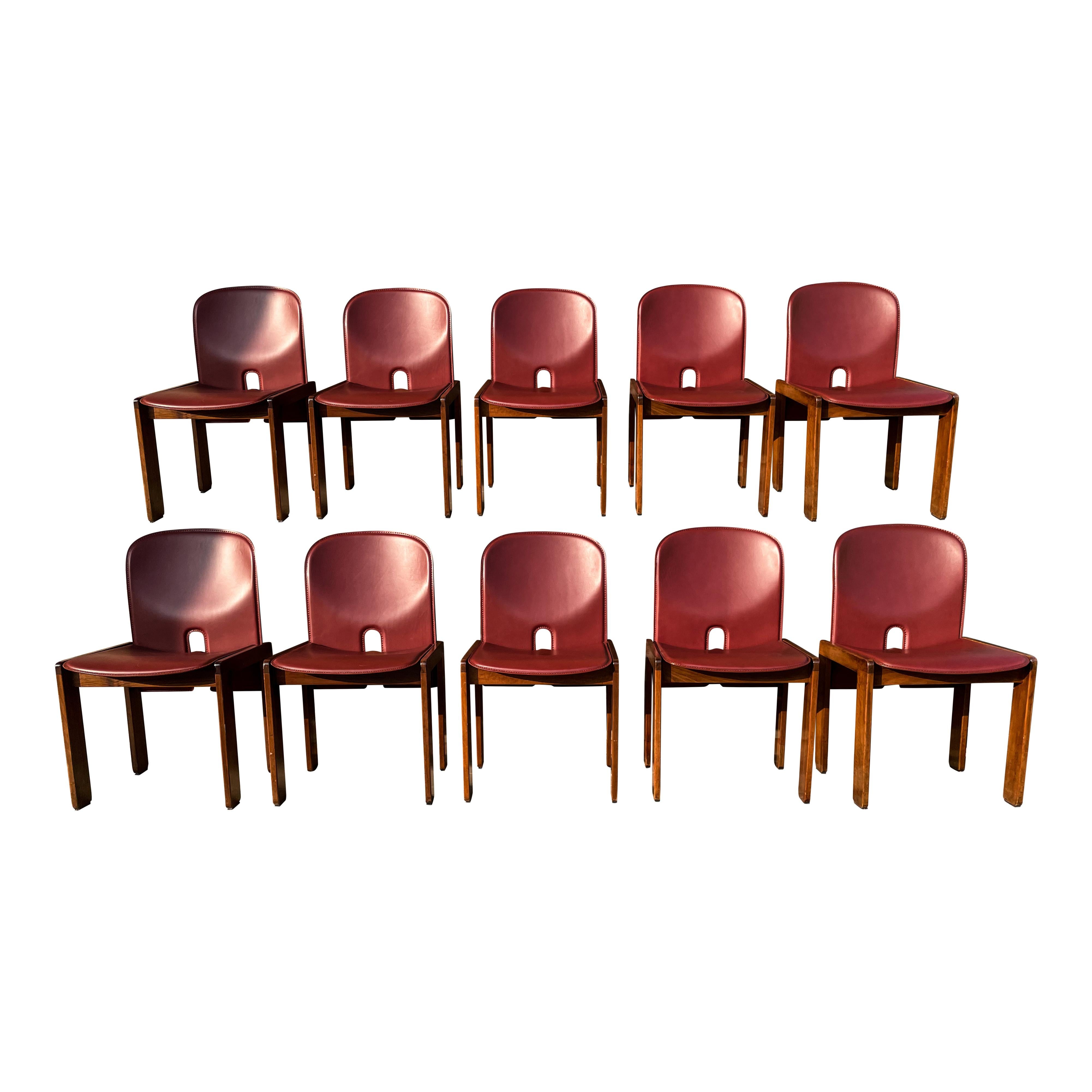 Set of ten Model 121 dining chairs, designed by Afra and Tobia Scarpa and produced by the Italian manufacturer Cassina in 1967.
They feature English red leather upholstery and a walnut structure.

Fully restored in Italy.

Afra and Tobia Scarpa