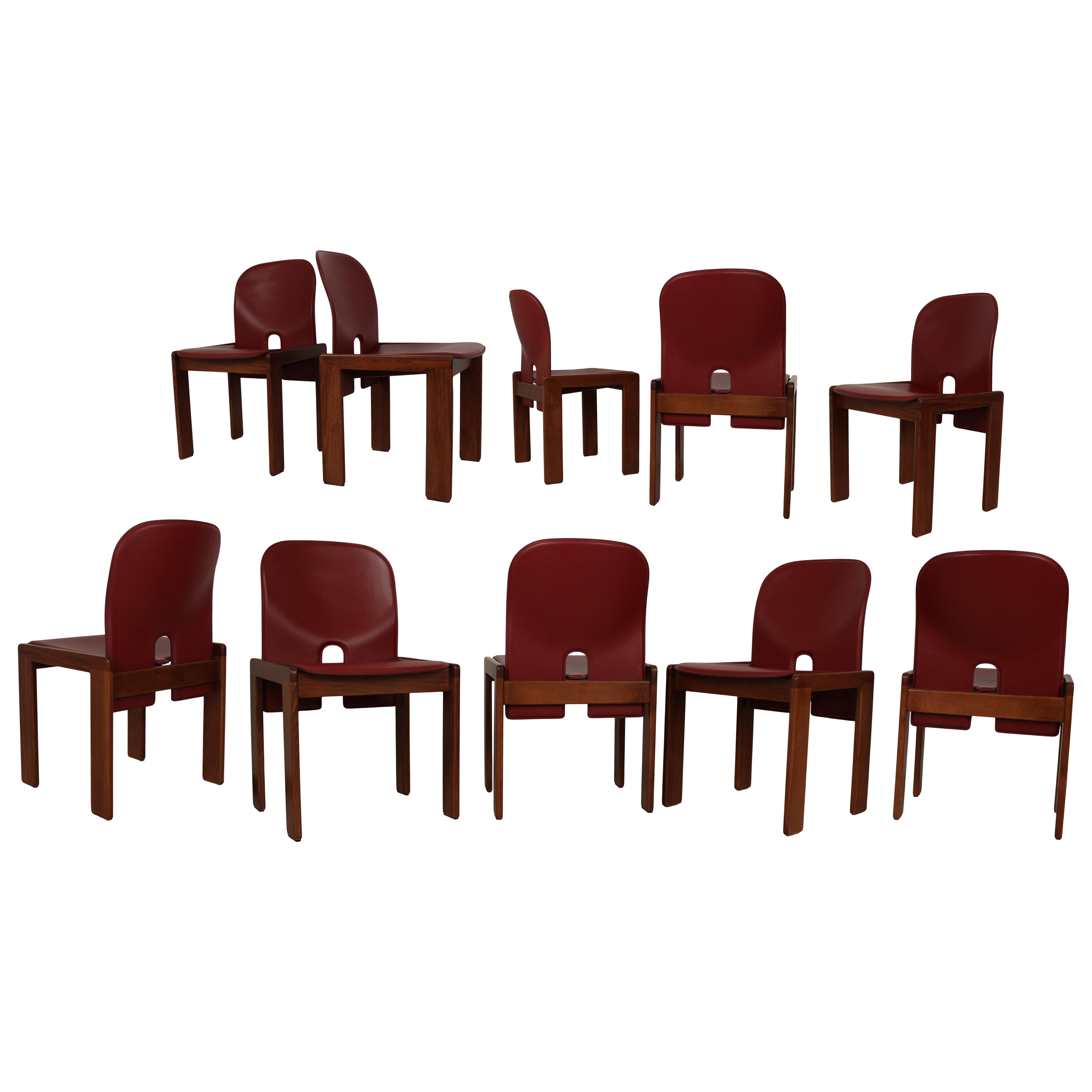Set of ten Model 121 dining chairs, designed by Afra and Tobia Scarpa and produced by the Italian manufacturer Cassina in 1967.
They feature English red leather upholstery and a walnut structure.

Fully restored in Italy.

Afra and Tobia Scarpa