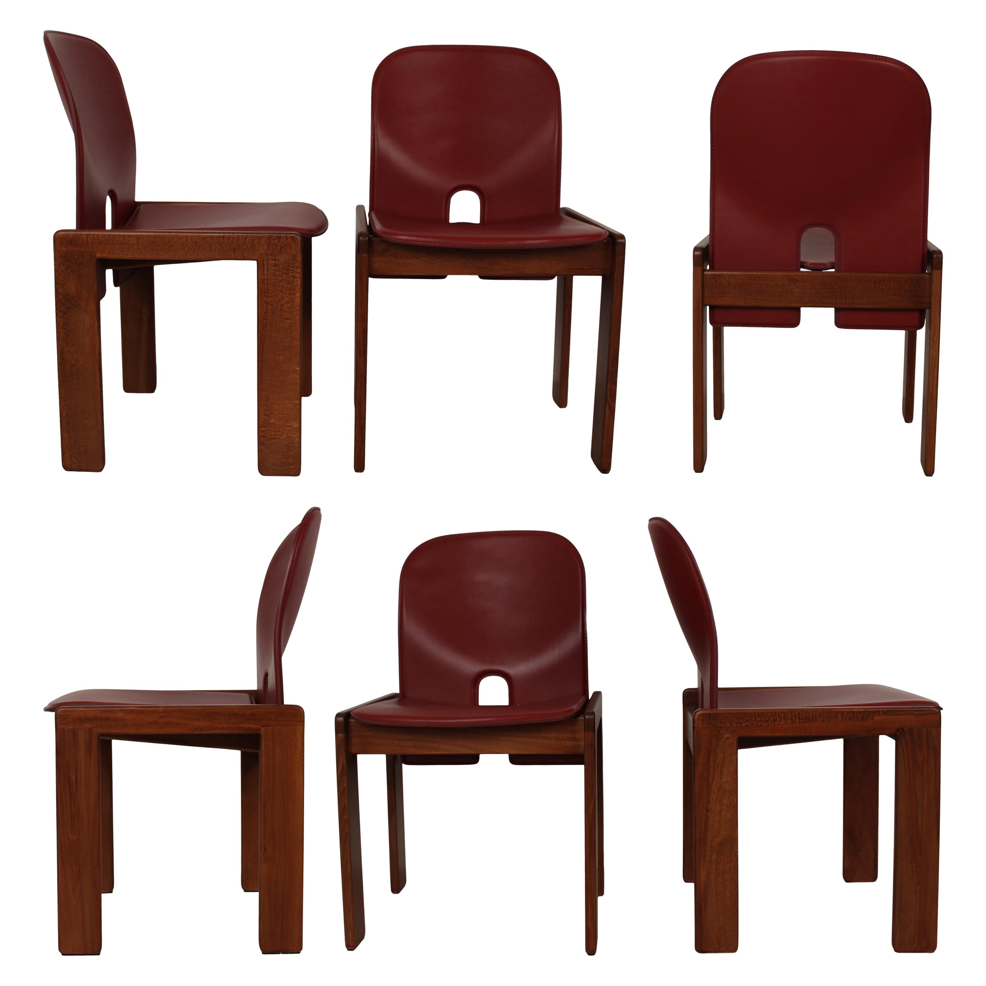 Set of six Model 121 dining chairs, designed by Afra and Tobia Scarpa and produced by the Italian manufacturer Cassina in 1967.
They feature English red leather upholstery and a walnut structure.

Fully restored in Italy.

Afra and Tobia Scarpa