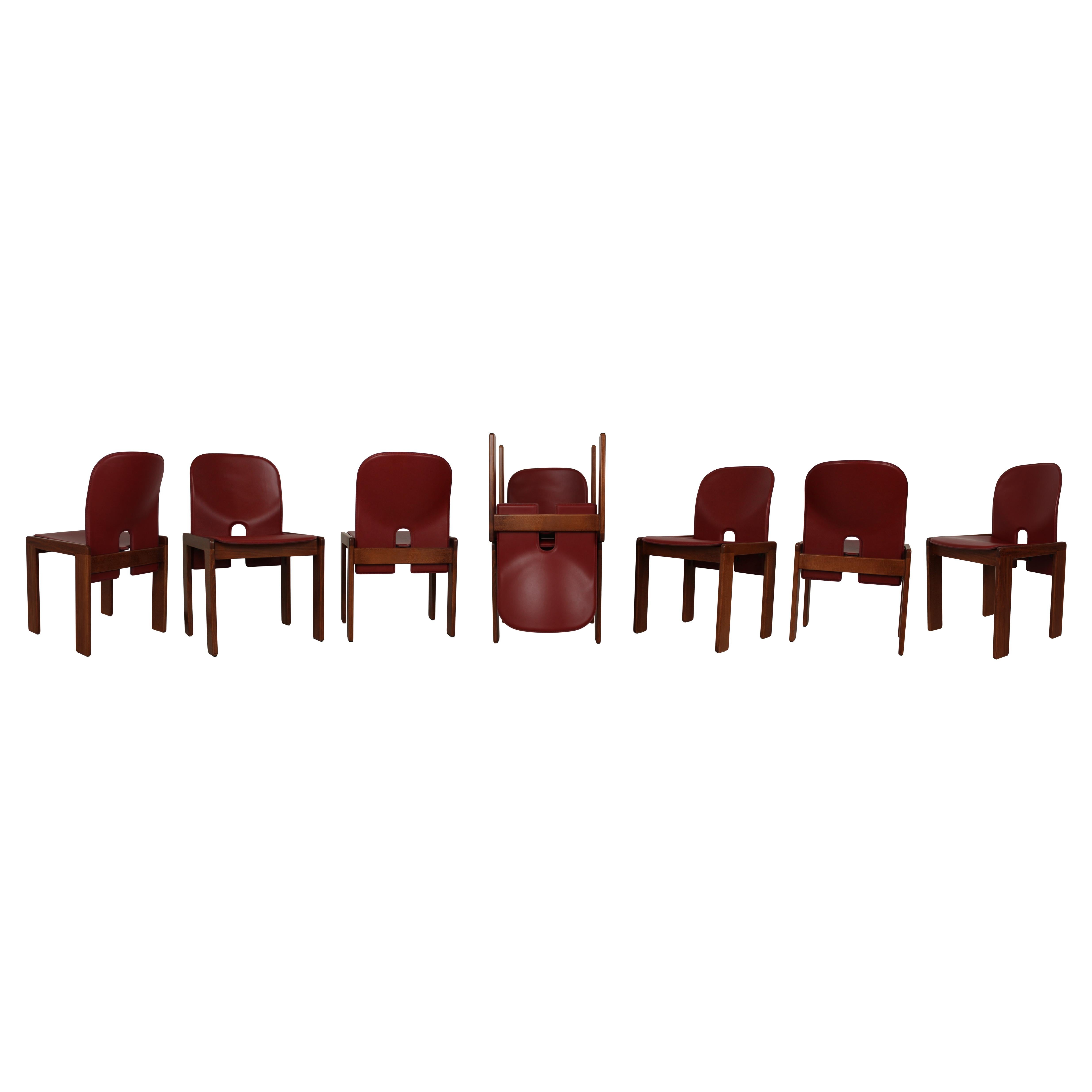 Set of eight Model 121 dining chairs, designed by Afra and Tobia Scarpa and produced by the Italian manufacturer Cassina in 1967.
They feature English red leather upholstery and a walnut structure.

Fully restored in Italy.

Afra and Tobia Scarpa