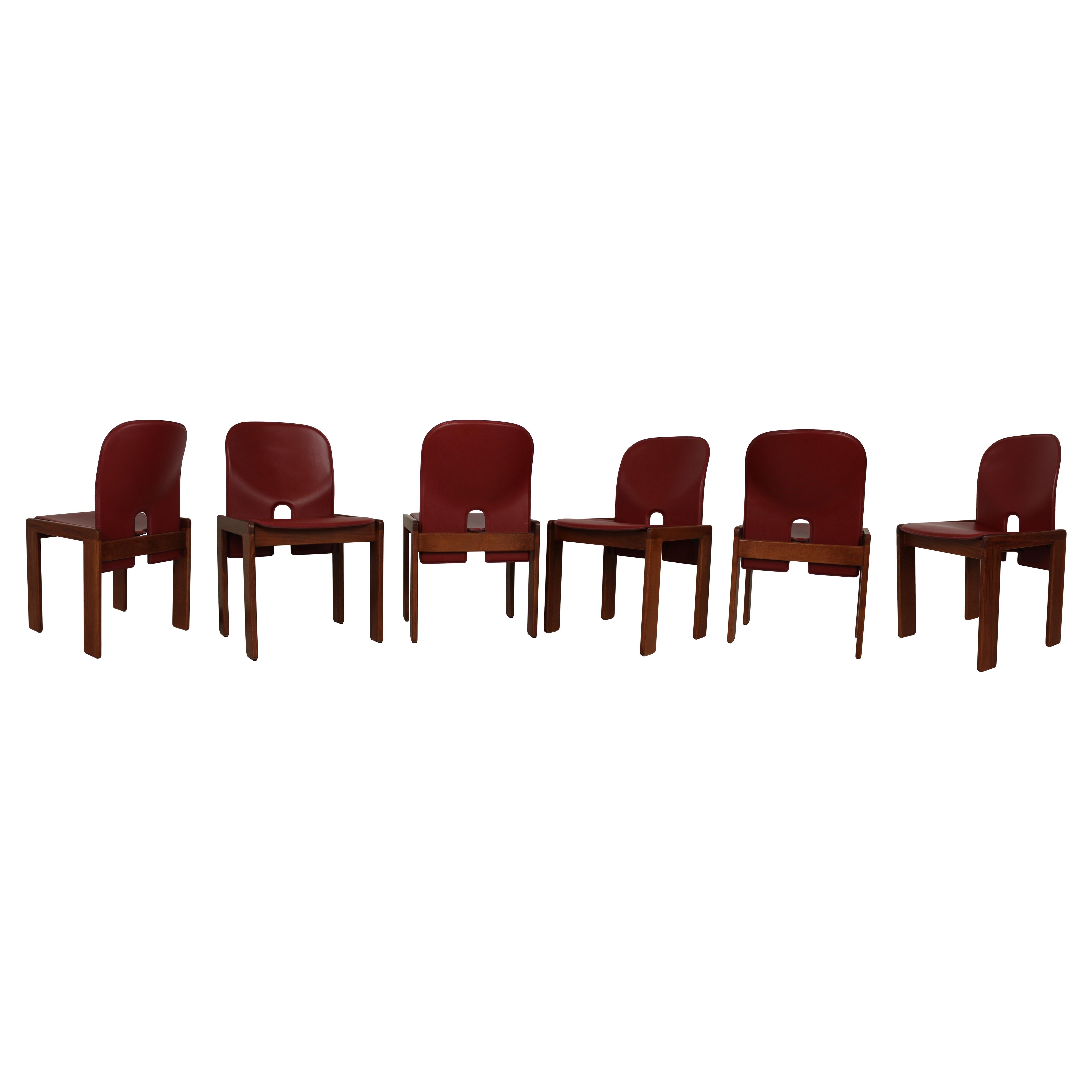 Set of eight Model 121 dining chairs, designed by Afra and Tobia Scarpa and produced by the Italian manufacturer Cassina in 1967.
They feature English red leather upholstery and a walnut structure.

Fully restored in Italy.

Afra and Tobia Scarpa
