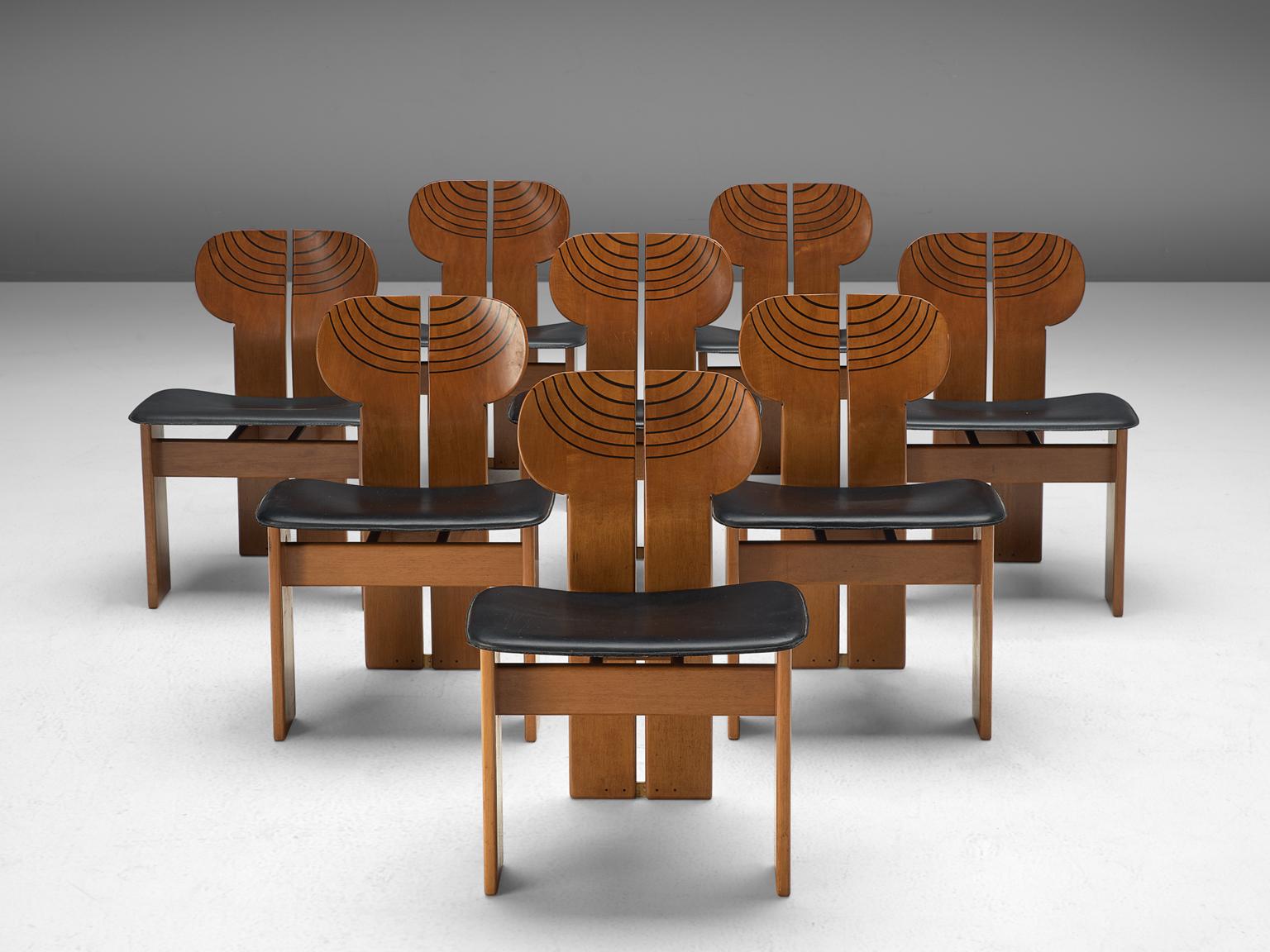 Afra & Tobia Scarpa, eight dining chairs, black leather, walnut, ebony and brass, Maxalto, Italy, 1975.

This set of chairs explicitly sculptural grand chairs are by Afra & Tobia Scarpa and are titled 'Africa' and are part of the Artona collection