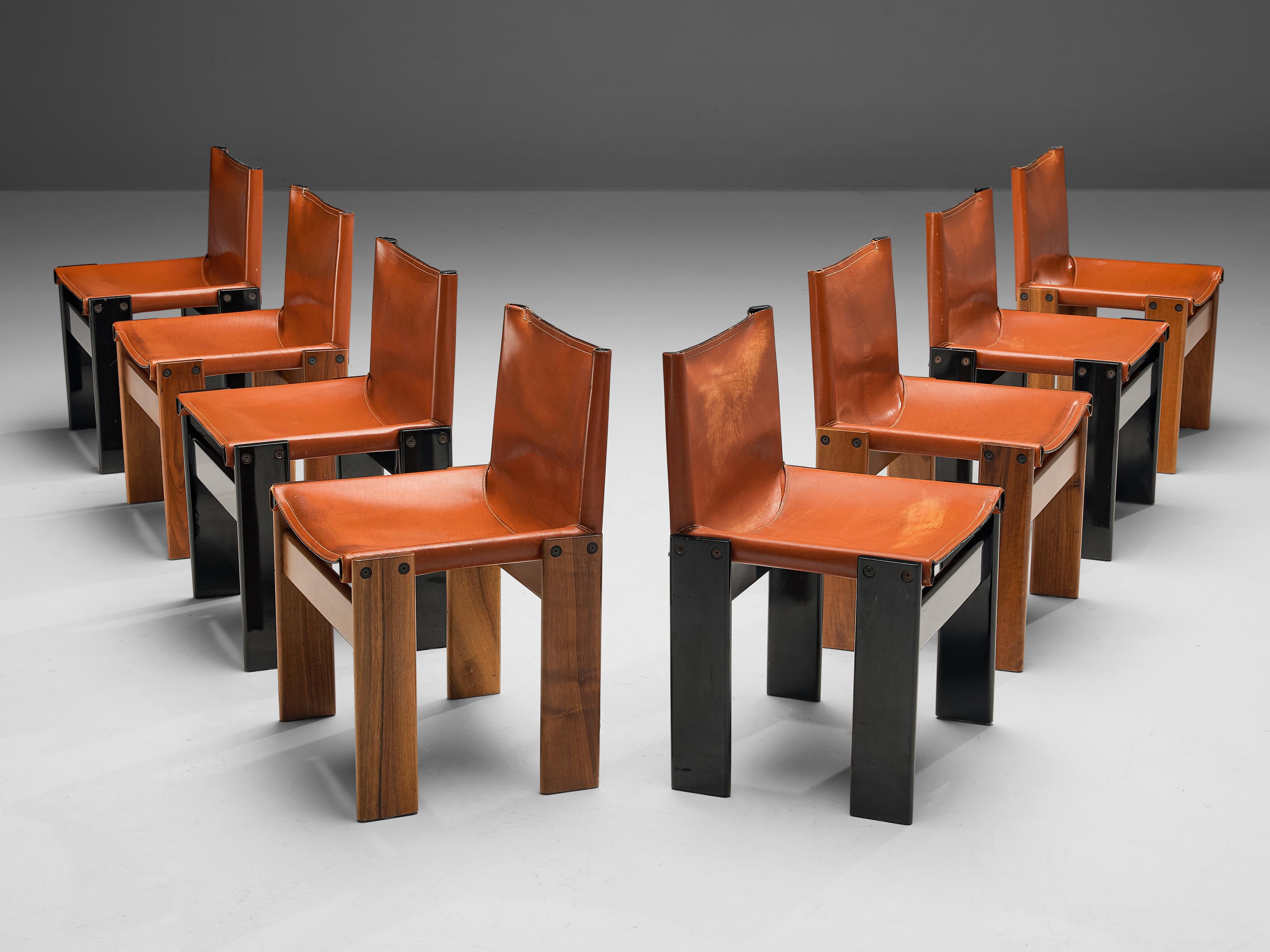 Afra & Tobia Scarpa, set of eight 'Monk' dining chairs, patinated walnut, black lacquered wood and cognac leather, Italy, 1974.

Set of eight 'Monk' chairs with a striking combination of walnut and black lacquered wooden frames. The wonderfully