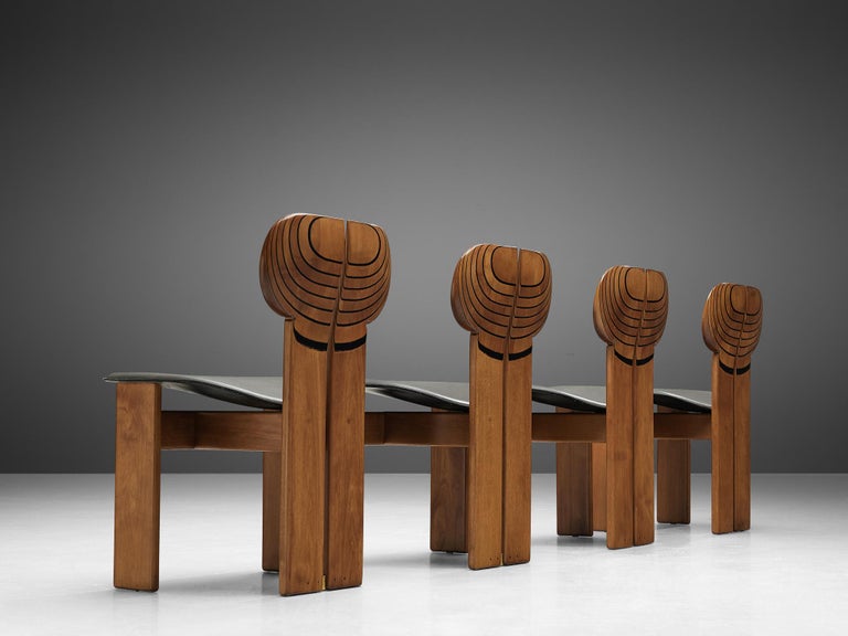 Afra & Tobia Scarpa for Maxalto, set of four dining chairs model 'Africa', dark grey leather, in walnut, ebony and brass, Italy, 1975.

This set of 'Africa' chairs explicitly sculptural grand chairs is designed by Afra & Tobia Scarpa. They are