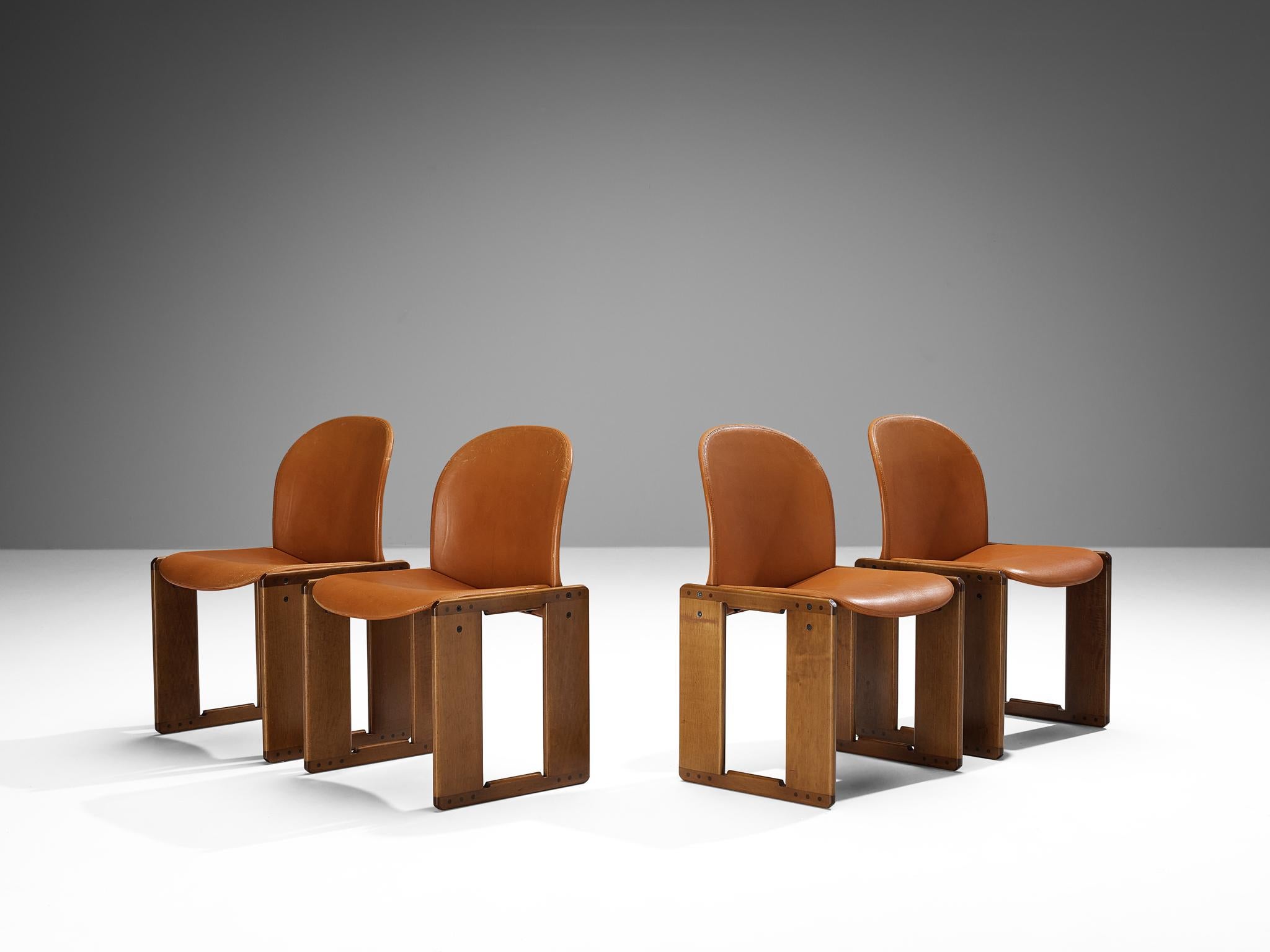 Afra and Tobia Scarpa for B&B, set of four ‘Dialogo’ dining chairs, walnut, cognac leather, metal, Italy, 1974
 
The ‘Dialogo’ dining chair was designed by Afra and Tobia Scarpa in 1974 and convinces with its two angular frames where the seat with