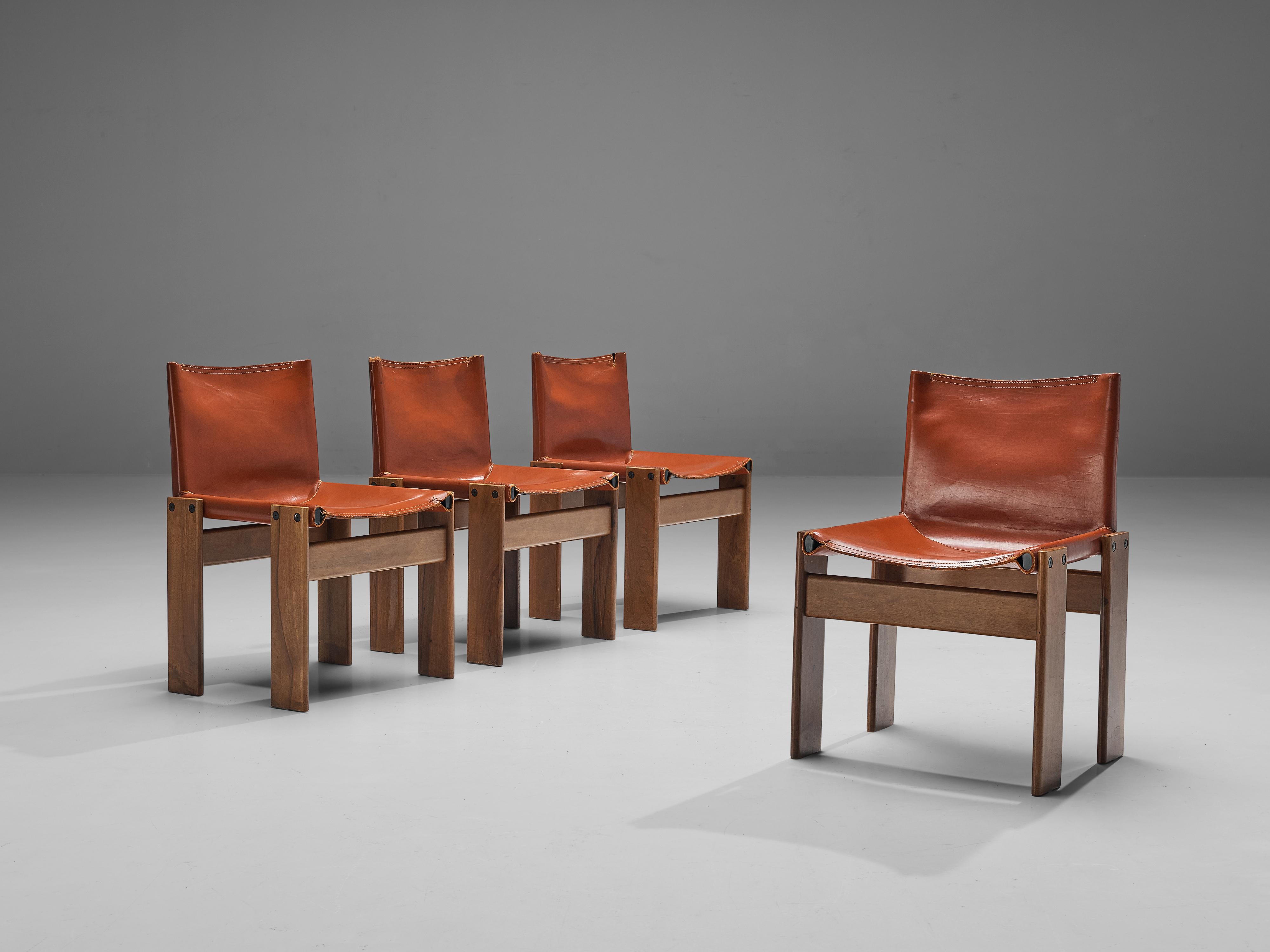 Afra & Tobia Scarpa, set of four 'Monk' dining chairs, patinated walnut and red leather, Italy, 1974.

The wonderfully red leather forms a striking combination with the vibrant orange wood. Interesting is the 'flat' shape of this chair where the