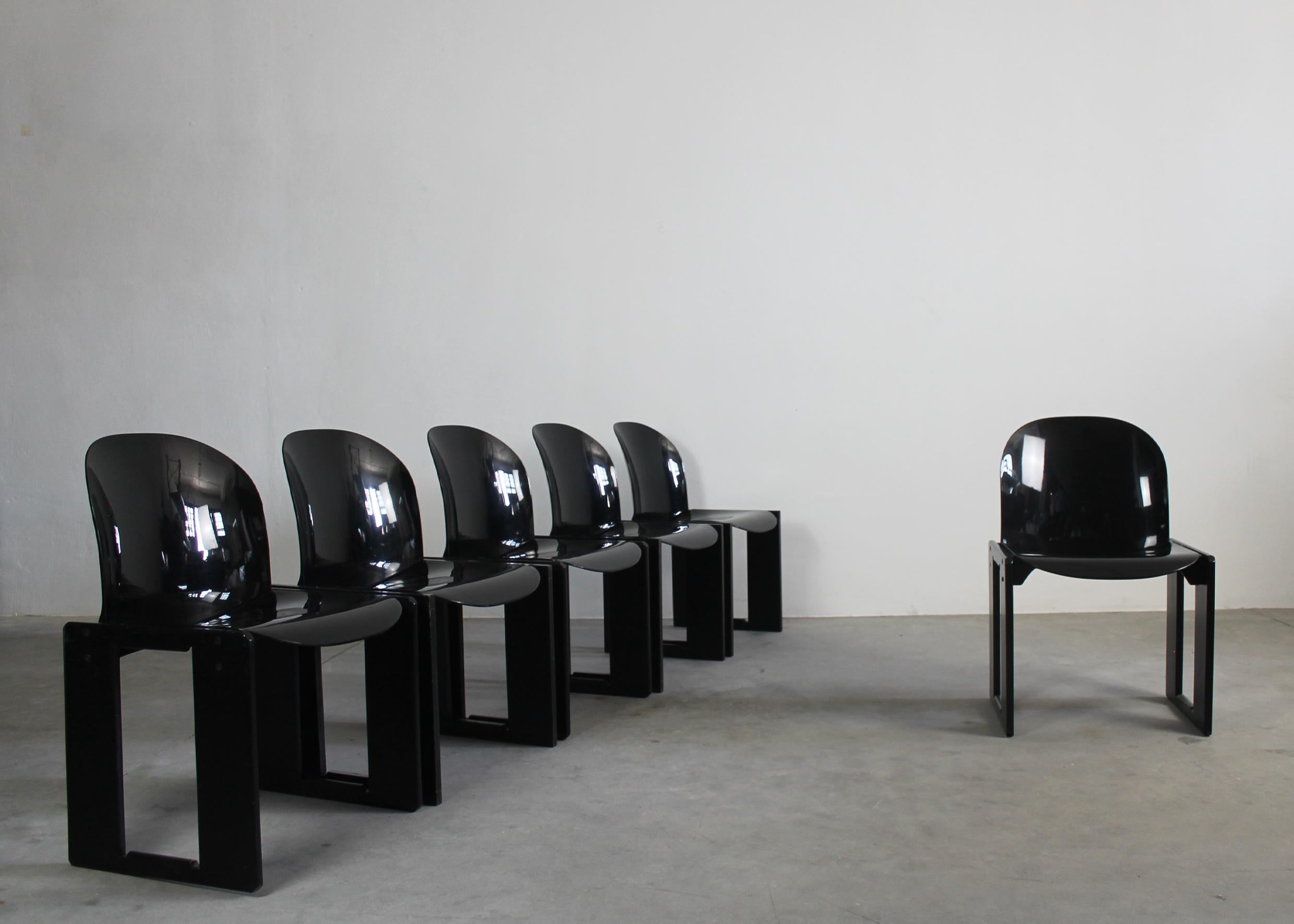 Set of six Dialogo chairs with structure in oak wood; seat and back in black fiberglass. 
Designed by Tobia and Afra Scarpa, produced by B&B Italia, 1970s.

Tobia Scarpa and his wife Afra Bianchin began their long career together in 1959, designing